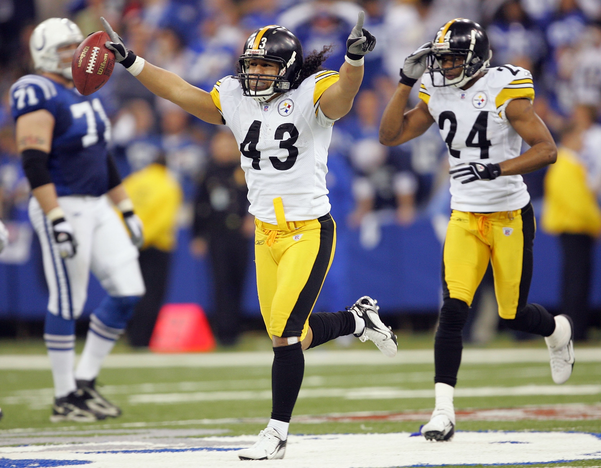 INDIANAPOLIS - JANUARY 15: Troy Polamalu #43 of the Pittsburgh Steelers runs ahead of teammate Ike Taylor #24 as he celebrates an interception, the interception was overturned when the ball was ruled incomplete after a replay challenge against the Indian INDIANAPOLIS - JANUARY 15: Troy Polamalu #43 of the Pittsburgh Steelers runs ahead of teammate Ike Taylor #24 as he celebrates an interception, the interception was overturned when the ball was ruled incomplete after a replay challenge against the Indian
