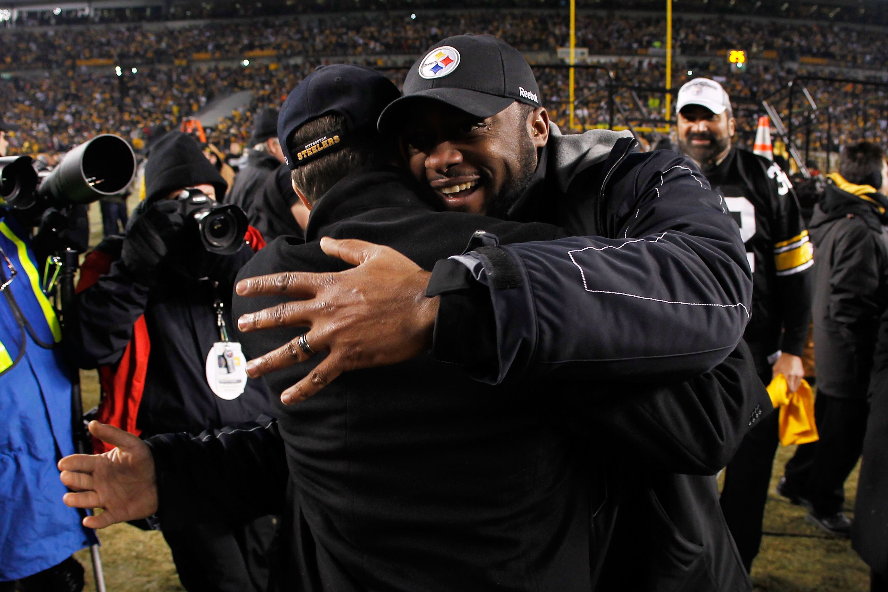 PITTSBURGH, PA - JANUARY 23:  Head coach Mike Tomlin and Team president Art Rooney II of the Pittsburgh Steelers celebrate their 24 to 19 win over the New York Jets during the 2011 AFC Championship game at Heinz Field on January 23, 2011 in Pittsburgh, Pe