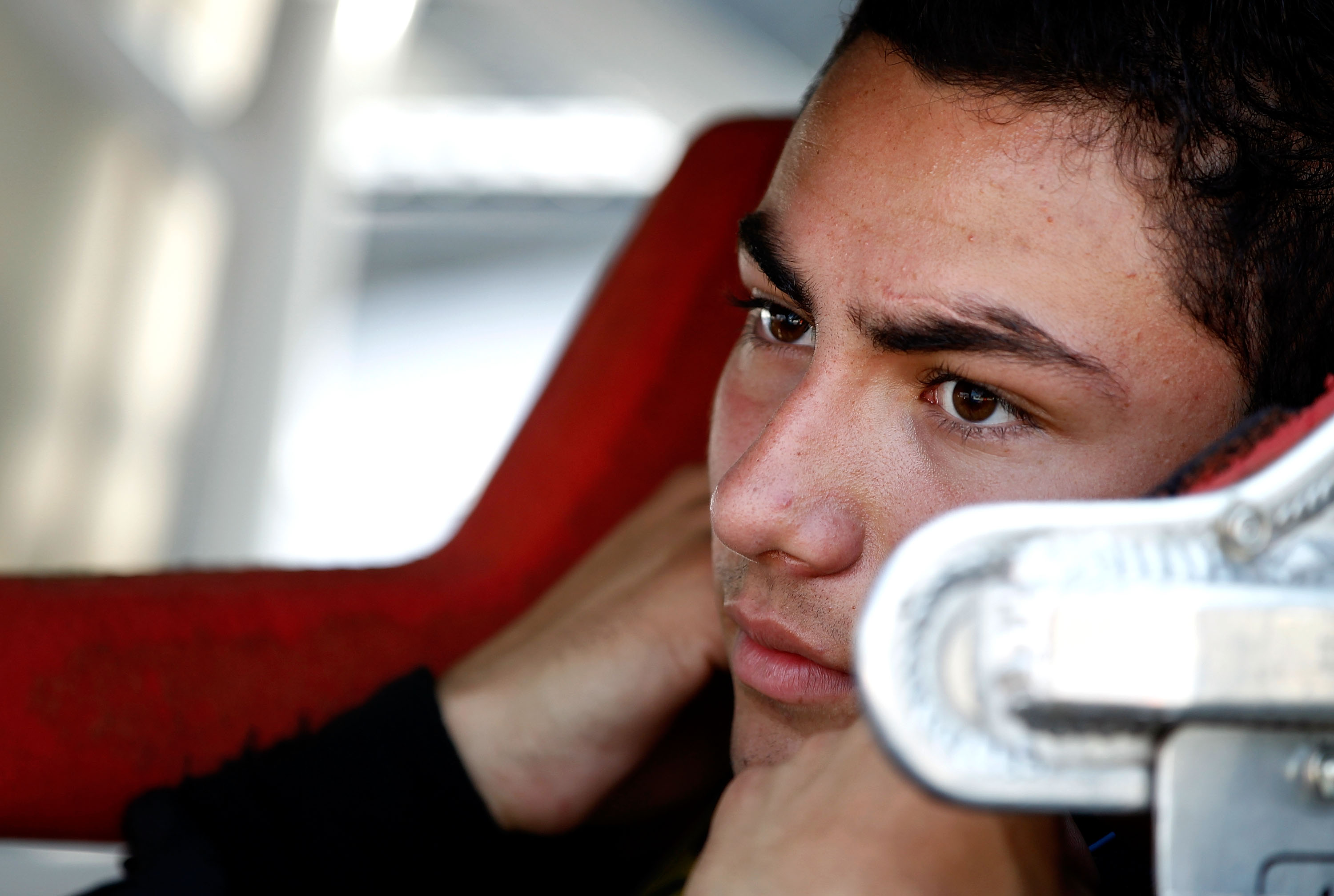 DOVER, DE - SEPTEMBER 24:  Sergio Pena, driver of the #4 Changing Lanes on BET Chevrolet, sits in his car during qualifying for the NASCAR K&N Pro Series East Sunoco 150 at Dover International Speedway on September 24, 2010 in Dover, Delaware.  (Photo by