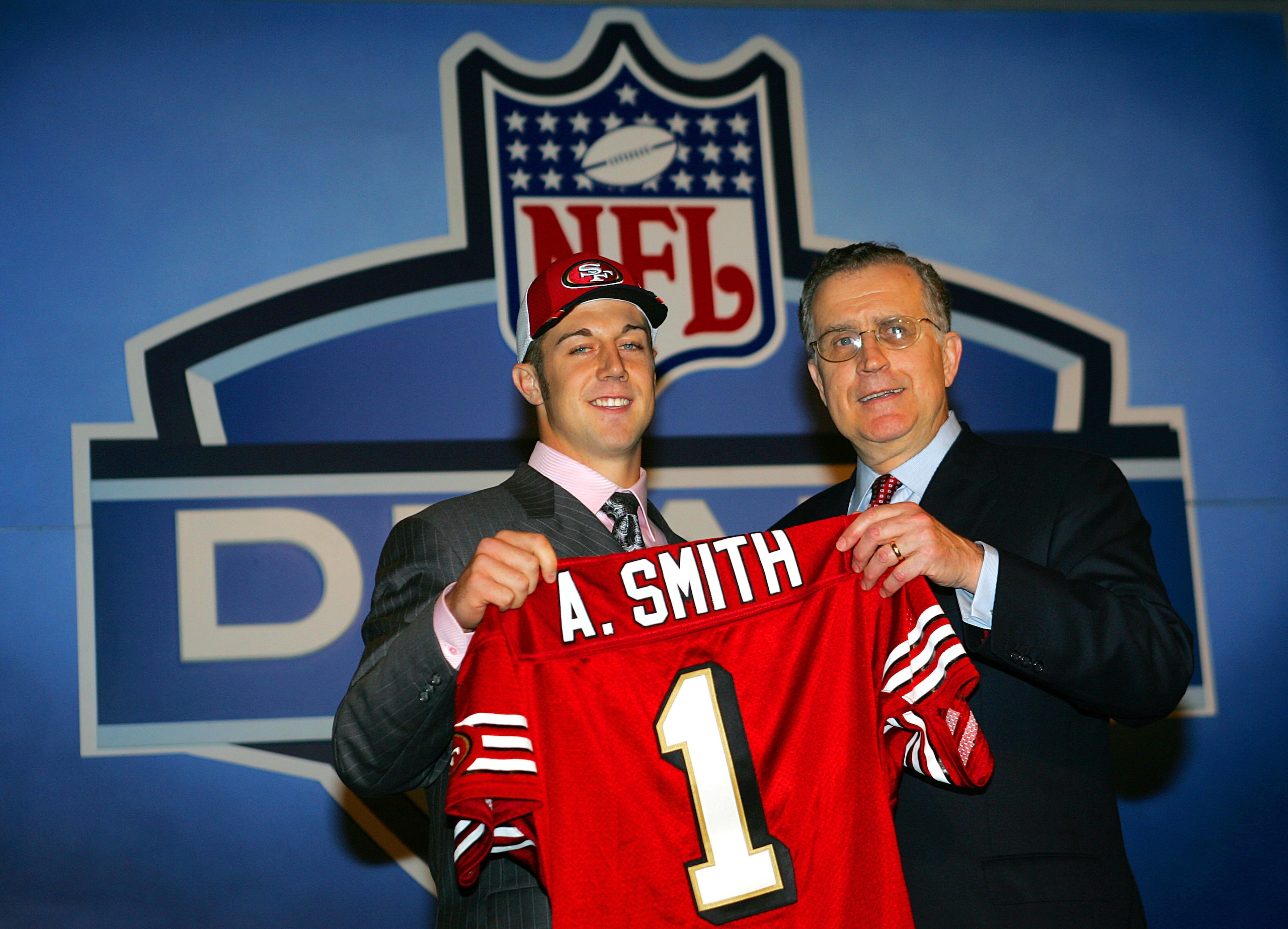 NEW YORK CITY - APRIL 23:  (L-R)  Quarterback Alex Smith (Utah) poses with NFL Commissioner Paul Tagliabue during the 70th NFL Draft on April 23, 2005 at the Jacob K. Javits Convention Center in New York City. Smith was drafted first overall by the San Fr