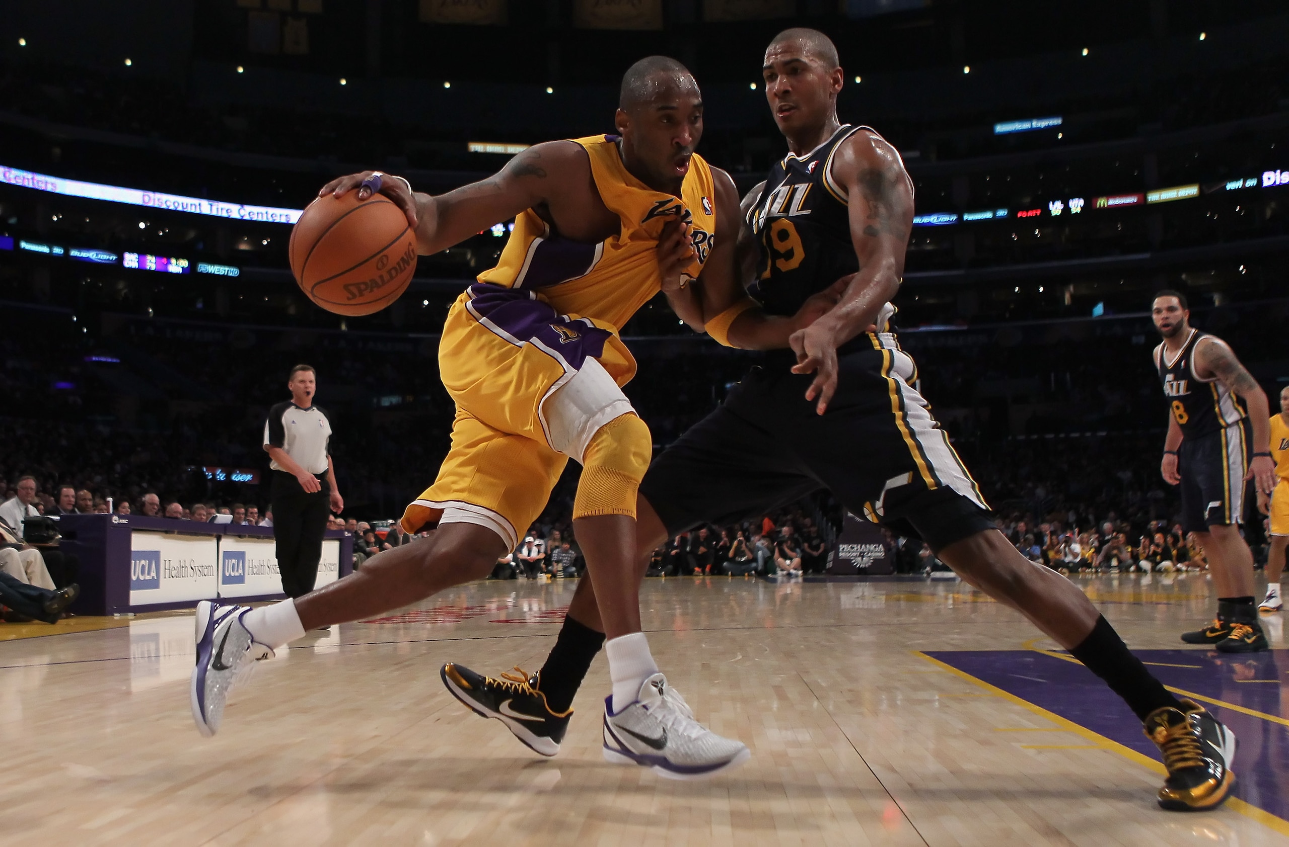 LOS ANGELES, CA - JANUARY 25: Kobe Bryant #24 of the Los Angeles Lakers drives to the basket while being defended by Raja Bell #19 of the Utah Jazz in the second half at Staples Center on January 25, 2011 in Los Angeles, California. The Lakers defeated t LOS ANGELES, CA - JANUARY 25: Kobe Bryant #24 of the Los Angeles Lakers drives to the basket while being defended by Raja Bell #19 of the Utah Jazz in the second half at Staples Center on January 25, 2011 in Los Angeles, California. The Lakers defeated t