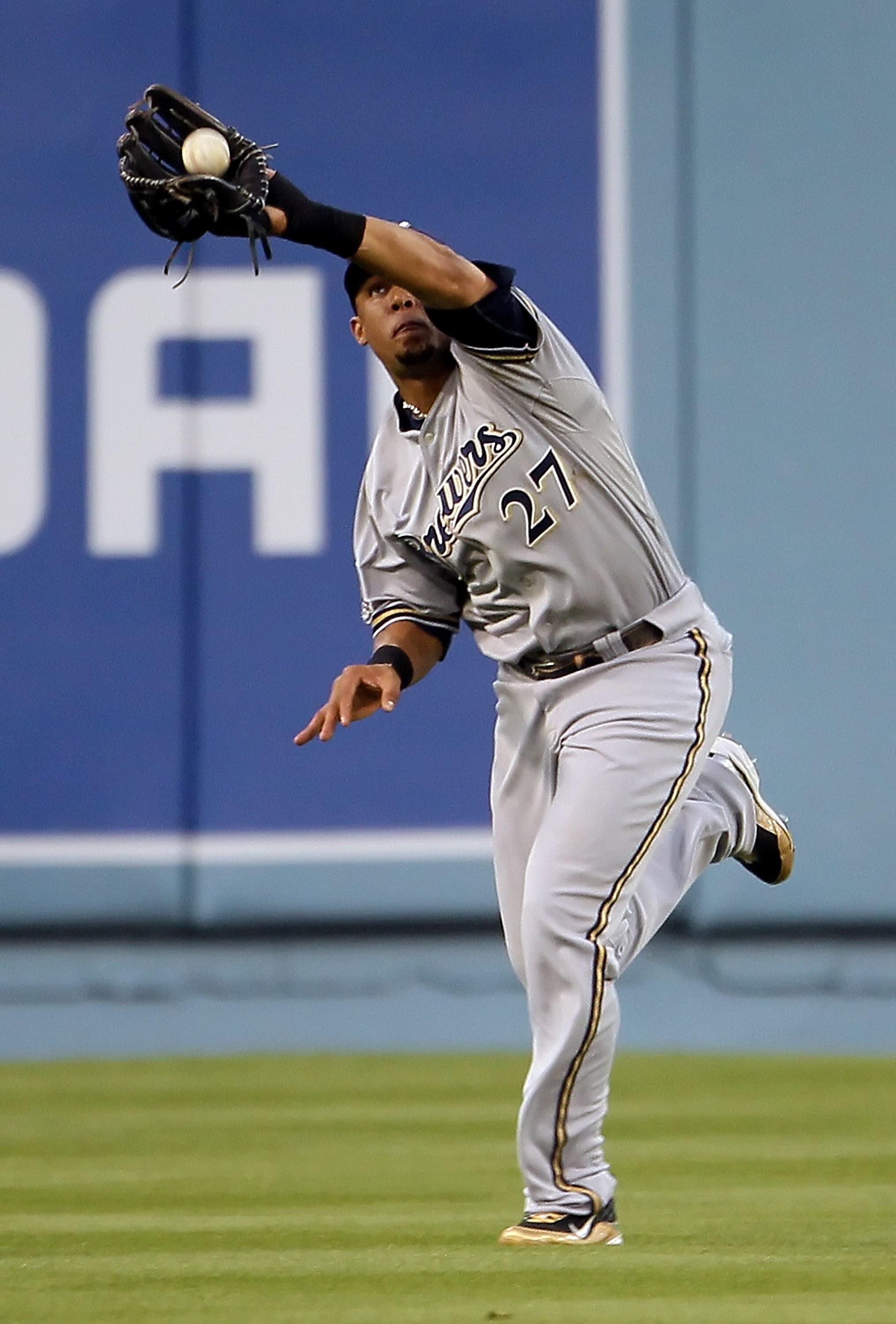 LOS ANGELES, CA - MAY 04:  Center fielder Carlos Gomez #27 of the Milwaukee Brewers catches a ball hit by Andre Ethier of the Los Angeles Dodgers in the first inning at Dodger Stadium on May 4, 2010 in Los Angeles, California.  (Photo by Jeff Gross/Getty