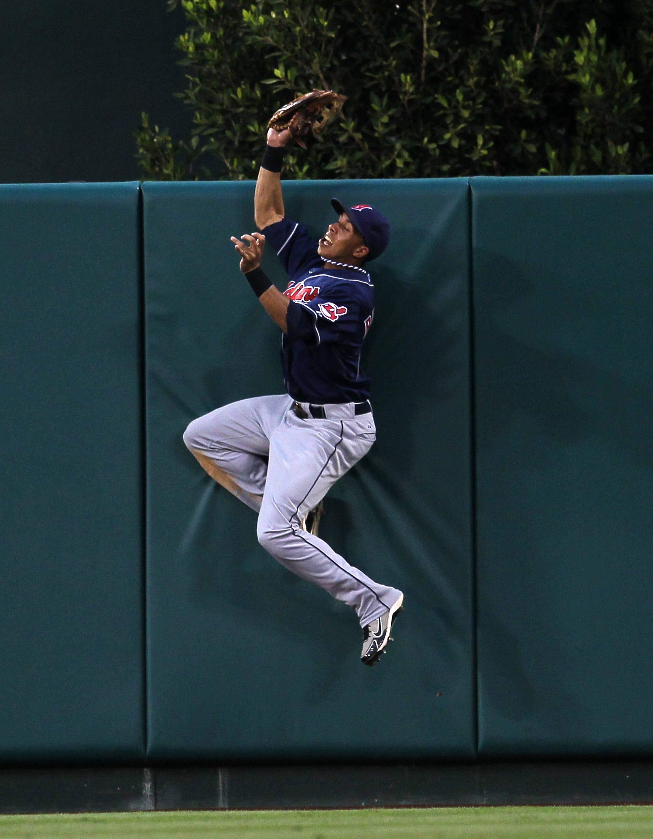 ANAHEIM, CA - SEPTEMBER 08: Center fielder Michael Brantley #23 of the Cleveland Indians jumps to catch a ball at the wall and deny a bid for a walk off home run by Juan Rivera #20 of the Los Angeles Angels of Anaheim in the tenth inning on September 8, ANAHEIM, CA - SEPTEMBER 08: Center fielder Michael Brantley #23 of the Cleveland Indians jumps to catch a ball at the wall and deny a bid for a walk off home run by Juan Rivera #20 of the Los Angeles Angels of Anaheim in the tenth inning on September 8,