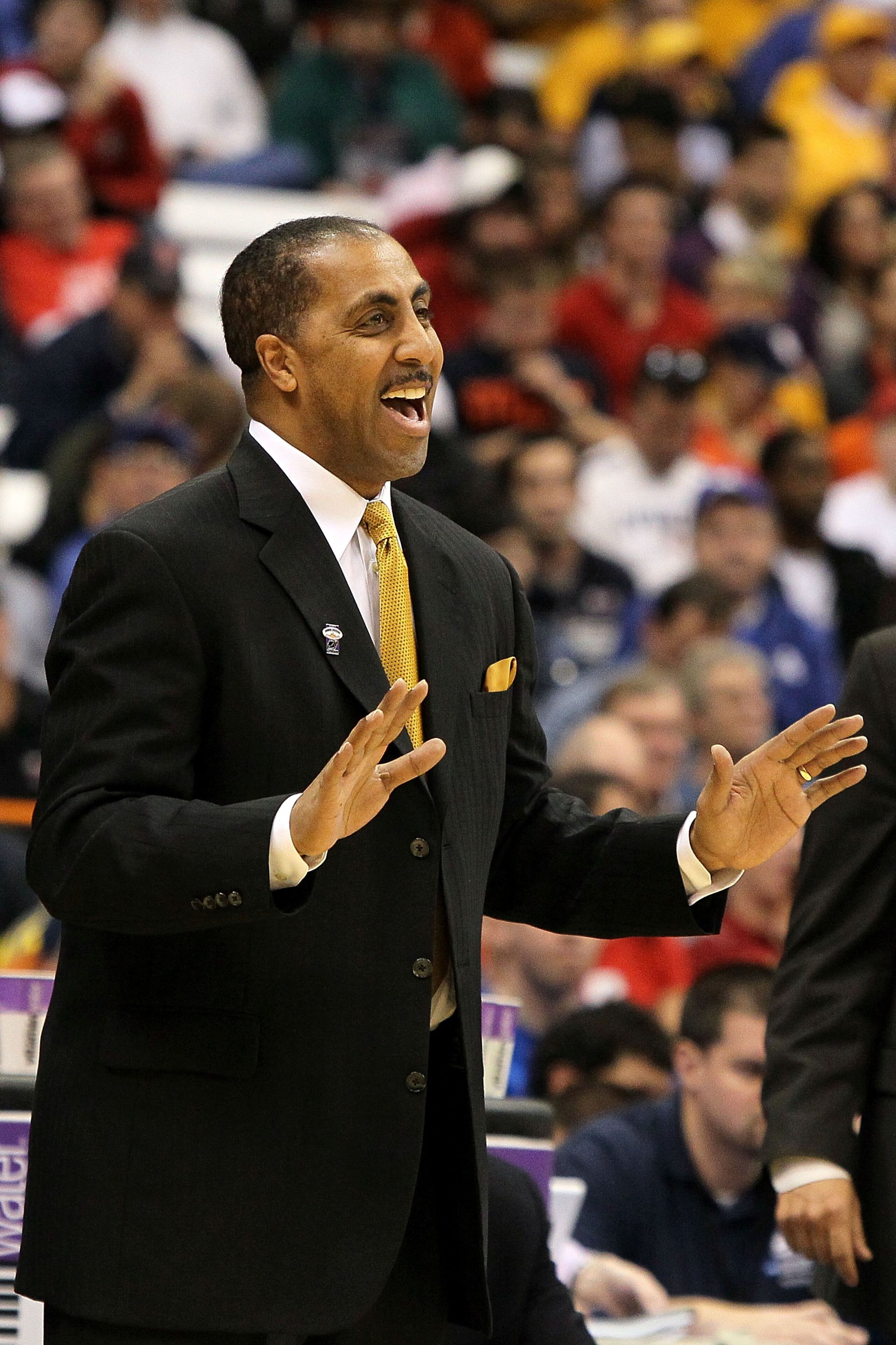SYRACUSE, NY - MARCH 25: Head coach Lorenzo Romar of the Washington Huskies reacts as he coaches against the West Virginia Mountaineers during the east regional semifinal of the 2010 NCAA men's basketball tournament at the Carrier Dome on March 25, 2010 SYRACUSE, NY - MARCH 25: Head coach Lorenzo Romar of the Washington Huskies reacts as he coaches against the West Virginia Mountaineers during the east regional semifinal of the 2010 NCAA men's basketball tournament at the Carrier Dome on March 25, 2010