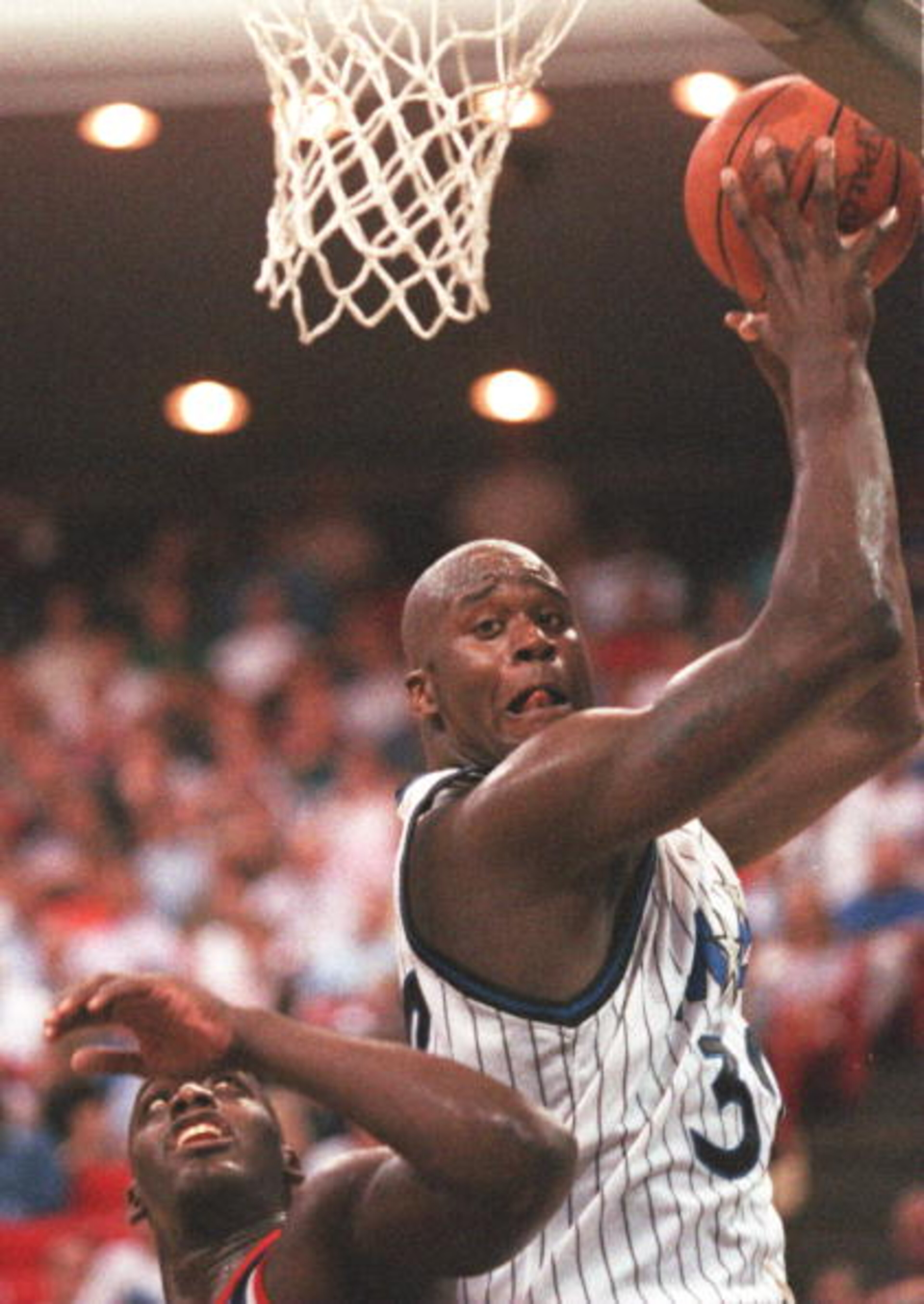 10 NOV 1994: SHAQUILLE O''NEAL OF THE ORLANDO MAGIC PULLS DOWN A REBOUND DURING A 101-99 LOSS TO THE NEW YORK KNICKS IN ORLANDO, FLORIDA. Mandatory Credit: ALLSPORT 10 NOV 1994: SHAQUILLE O''NEAL OF THE ORLANDO MAGIC PULLS DOWN A REBOUND DURING A 101-99 LOSS TO THE NEW YORK KNICKS IN ORLANDO, FLORIDA. Mandatory Credit: ALLSPORT