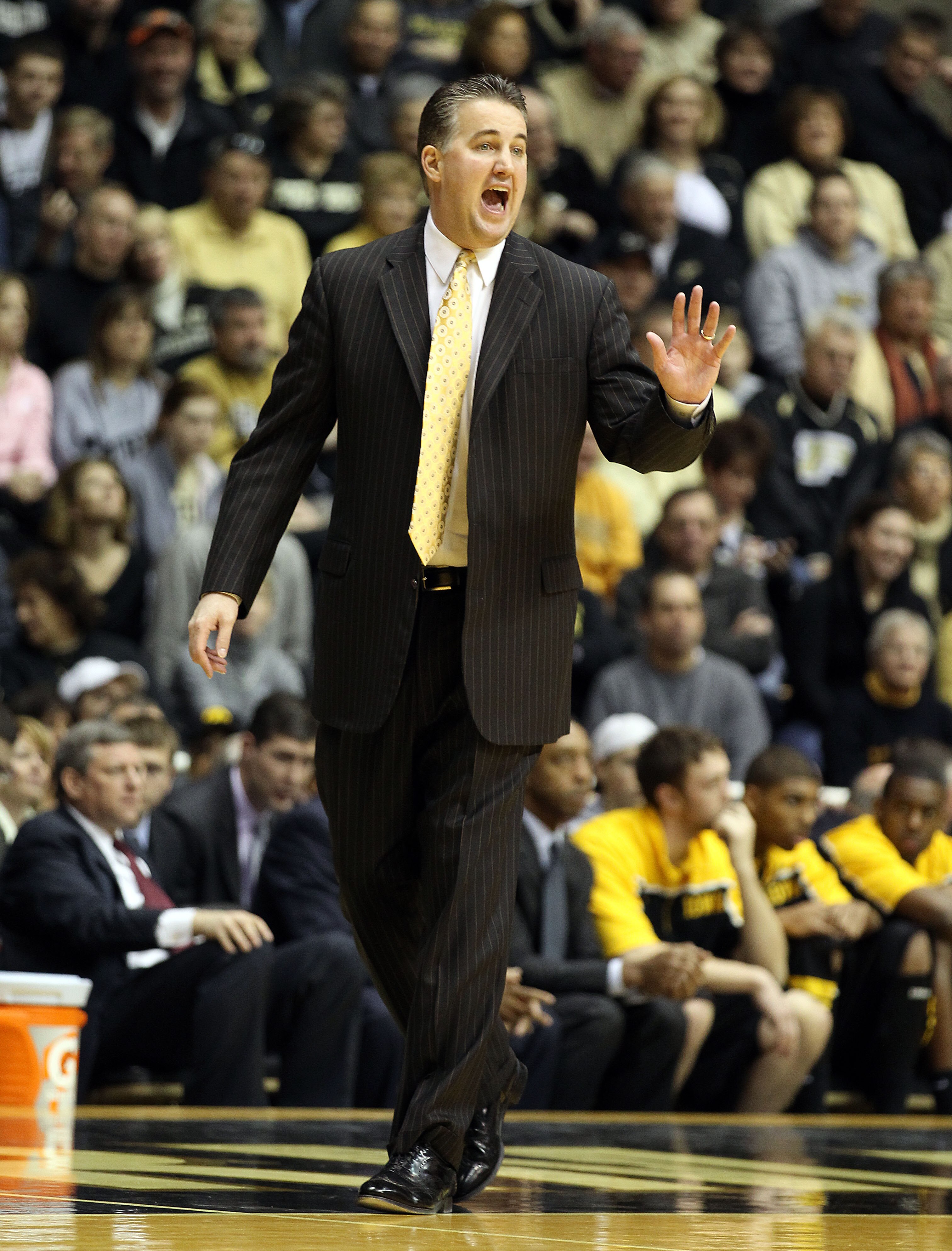 WEST LAFAYETTE, IN - JANUARY 09:  Matt Painter the Head Coach of the Purdue Boilermakers gives instructions to his team during the Big Ten Conference game against the Iowa Hawkeyes at Mackey Arena on January 9, 2011 in West Lafayette, Indiana.  Purdue won