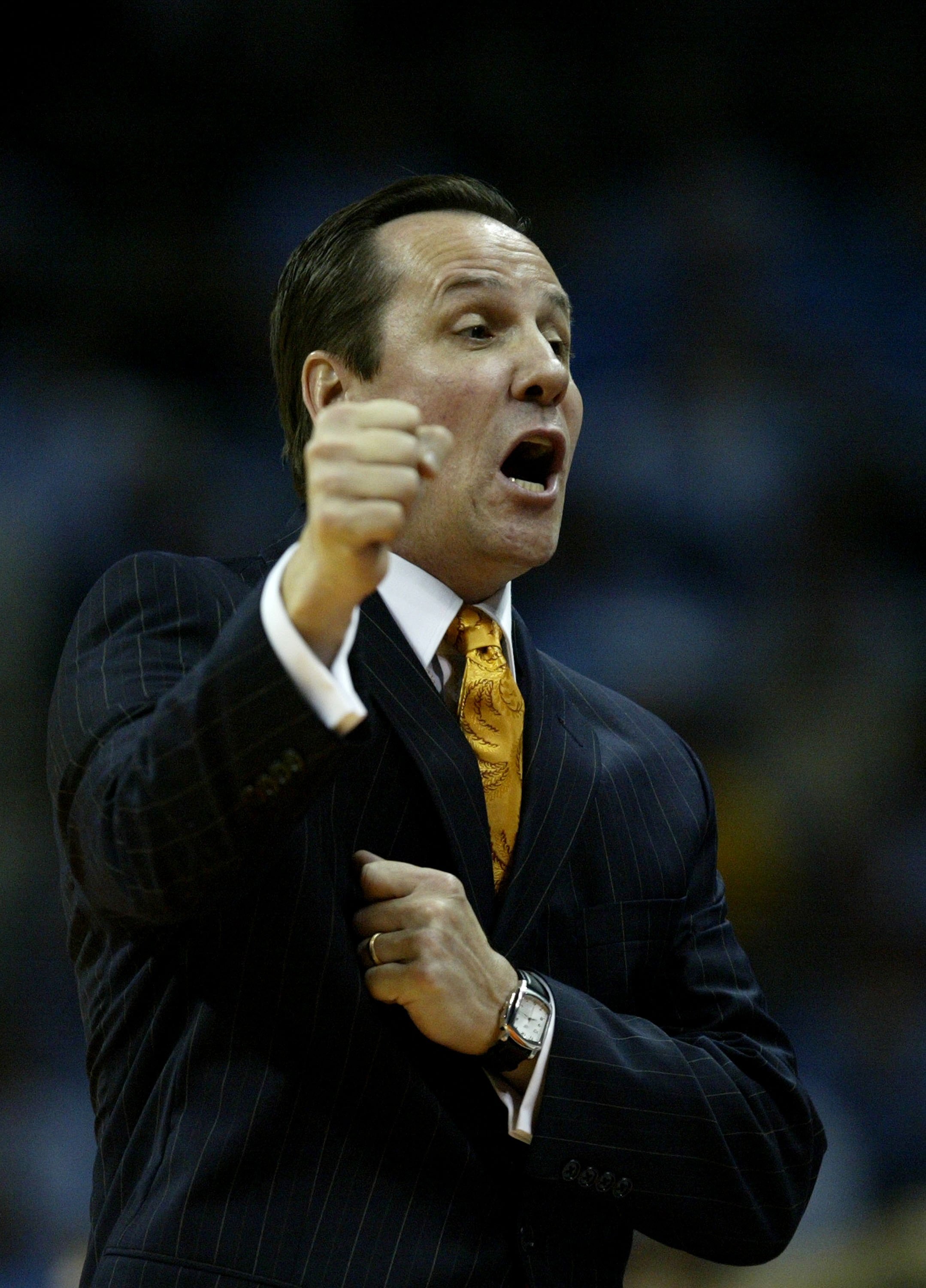 CHARLOTTE, NC - NOVEMBER 15:  Head coach Greg Marshall of the Winthrop Eagles cheers on his team on during a game against the University of North Carolina Tar Heels November 15, 2006 at the Charlotte Bobcats Arena in Charlotte, North Carolina.  (Photo by