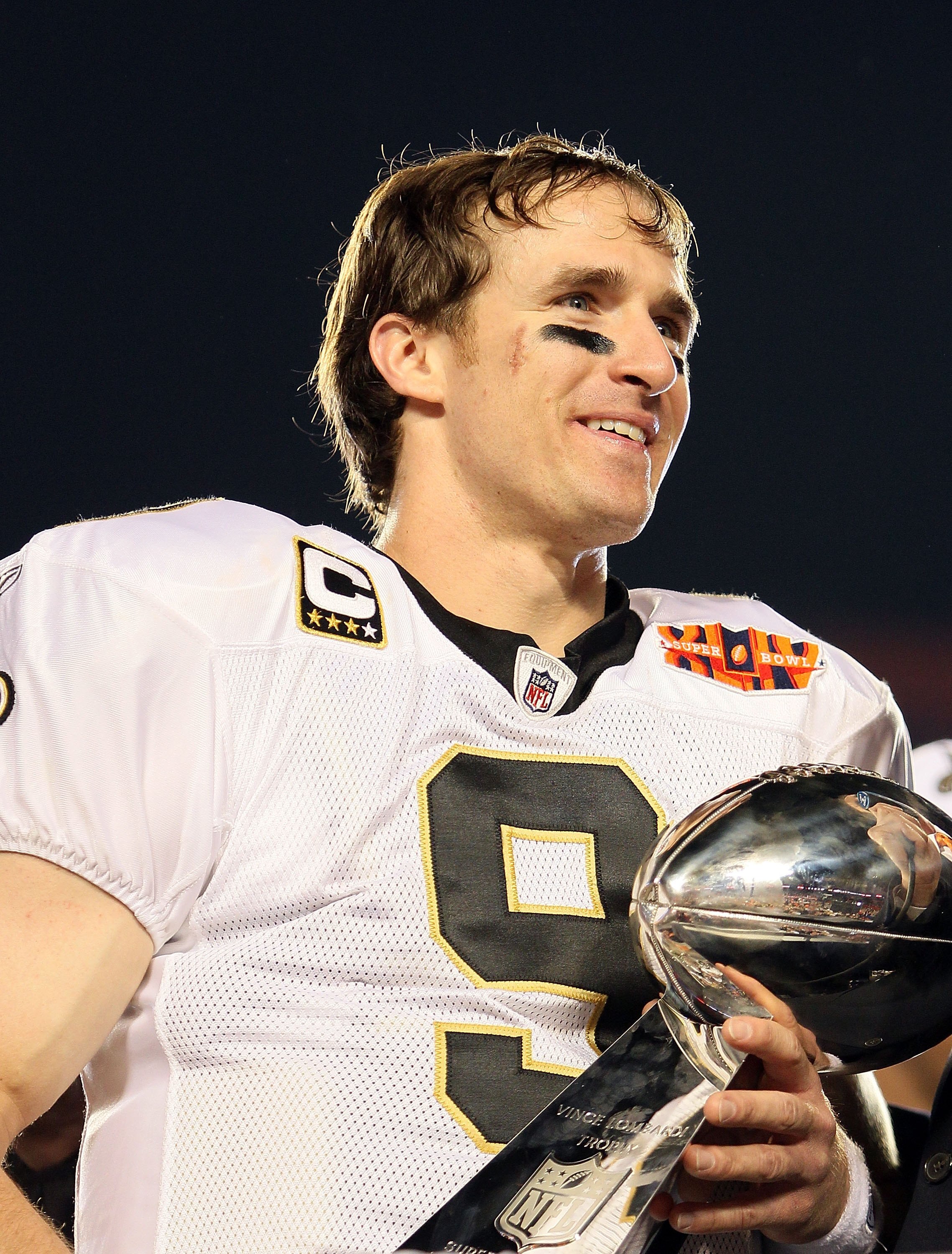 MIAMI GARDENS, FL - FEBRUARY 07:  Quarterback Drew Brees #9 of the New Orleans Saints celebrates after his team defeated the Indianapolis Colts during Super Bowl XLIV on February 7, 2010 at Sun Life Stadium in Miami Gardens, Florida.  (Photo by Andy Lyons