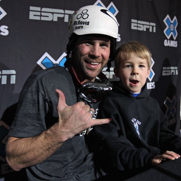 ASPEN, CO - JANUARY 29:  Nick Baumgartner of the USA poses for a photo with his son Landon after winning the gold medal in the Men's Snowboarder X at Winter X Games 15 at Buttermilk Mountain on January 29, 2011 in Aspen, Colorado.  (Photo by Doug Pensinge