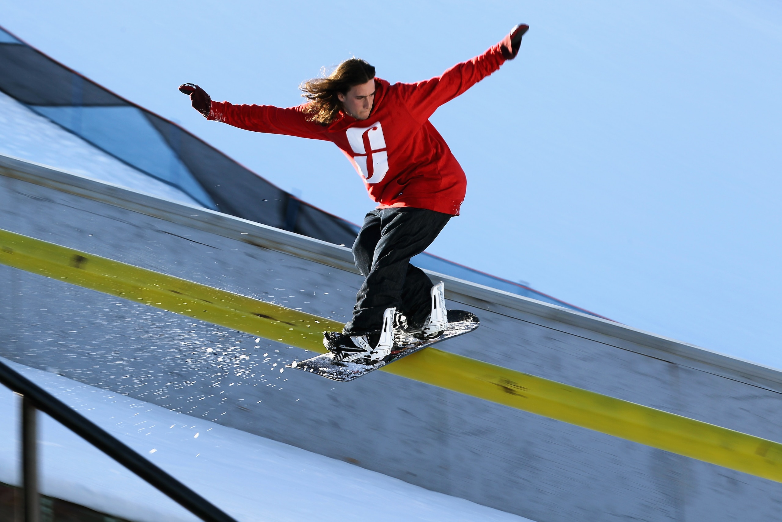ASPEN, CO - JANUARY 28:  Nic Sauve of Canada slides a rail during practice for the Snowboard Street Event at Winter X Games 15 at Buttermilk Mountain on January 28, 2011 in Aspen, Colorado. The Snowboard Street Event is debuting at Winter X 15.  (Photo by