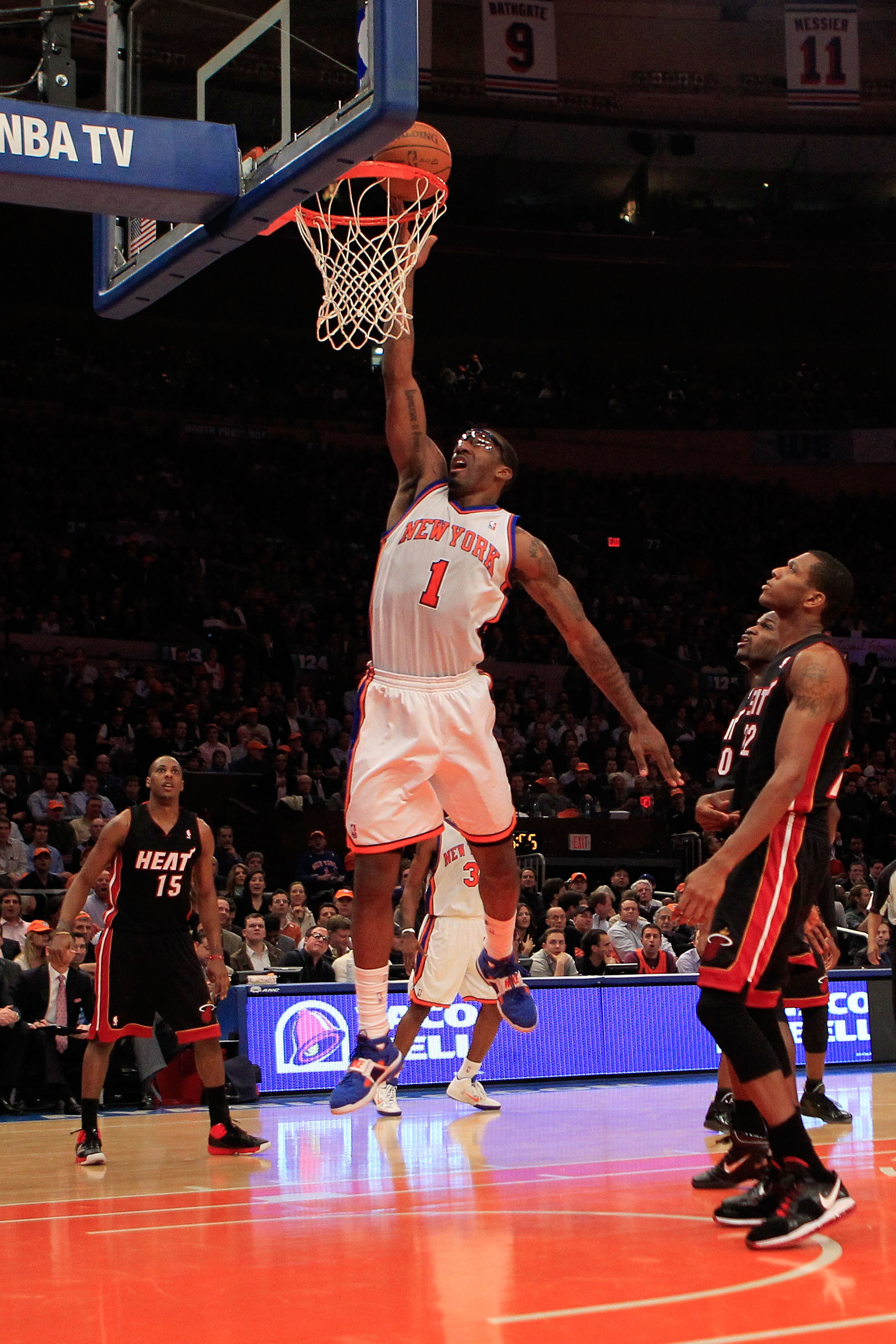 NEW YORK, NY - JANUARY 27:  Amar'e Stoudemire #1 of the New York Knicks lays the ball up against the Miami Heat at Madison Square Garden on January 27, 2011 in New York City. NOTE TO USER: User expressly acknowledges and agrees that, by downloading and/or