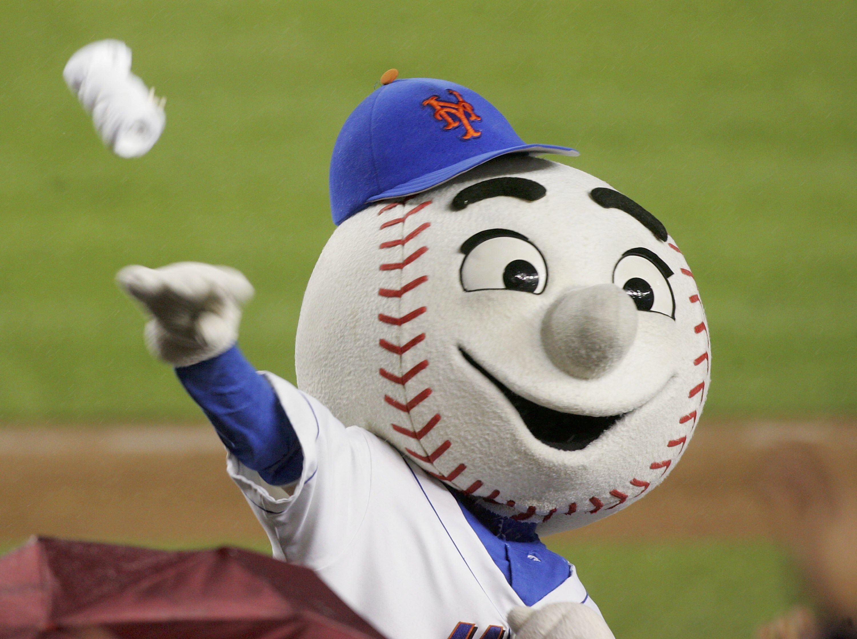 FLUSHING, NY - MAY 03:  Mr. Met throws t-shirts to the fans between innings of the New York Mets game against the Pittsburgh Pirates on May 3, 2006 at Shea Stadium in the Flushing neighborhood of the Queens borough of New York City. The Mets defeated the