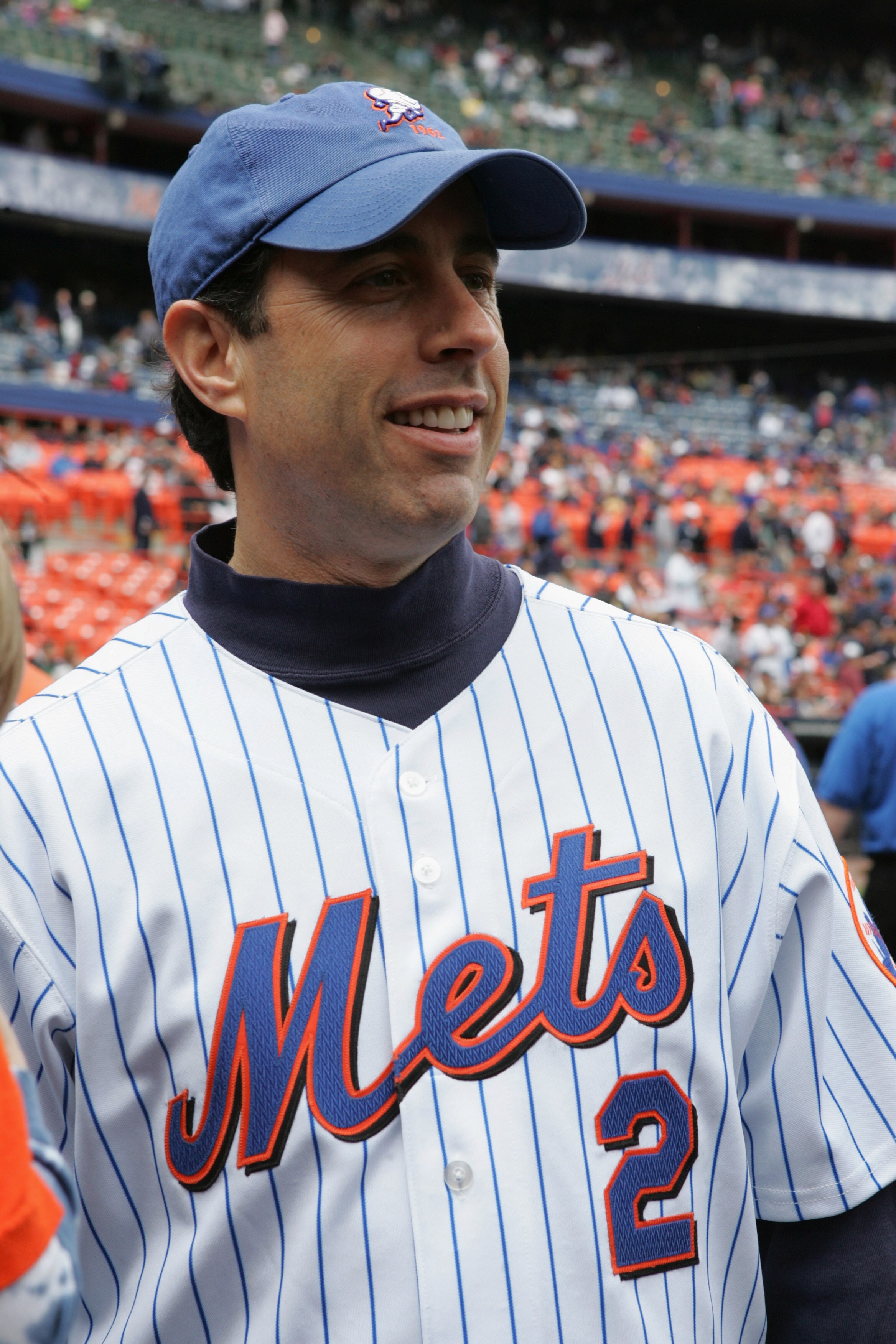 FLUSHING, NY - MAY 22:  Comedian Jerry Seinfeld prepares to throw the first pitch of the game between the New York Mets and the New York Yankees at Shea Stadium on May 22, 2005 in Flushing, New York. The Yankees defeated the Mets 5-3. (Photo by Jim McIsaa