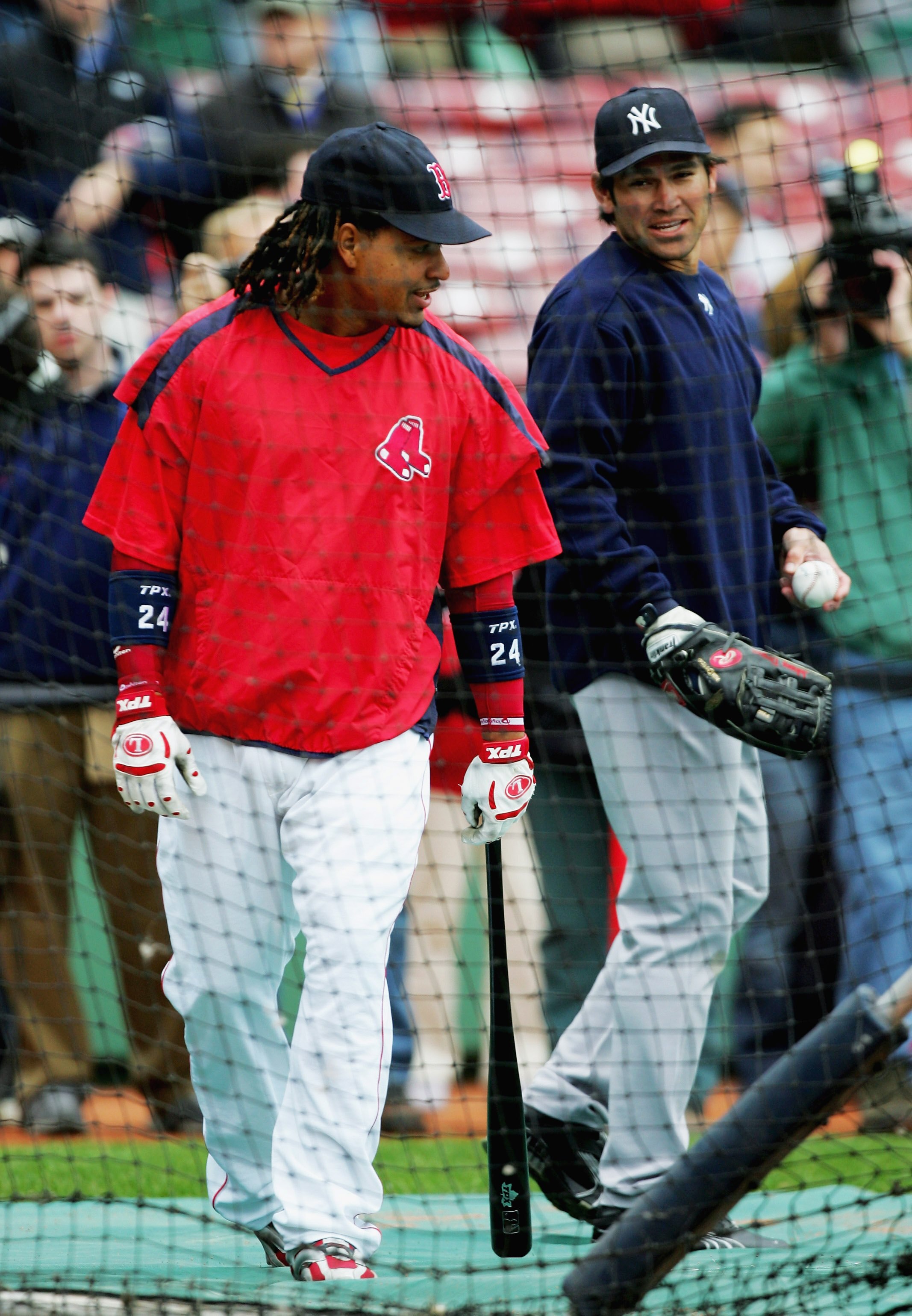 BOSTON - MAY 01:  Johnny Damon of the New York Yankees talks with former teammate Manny Ramirez of the Boston Red Sox at Fenway Park May 1, 2006 in Boston, Massachusetts.  (Photo by Ezra Shaw/Getty Images)