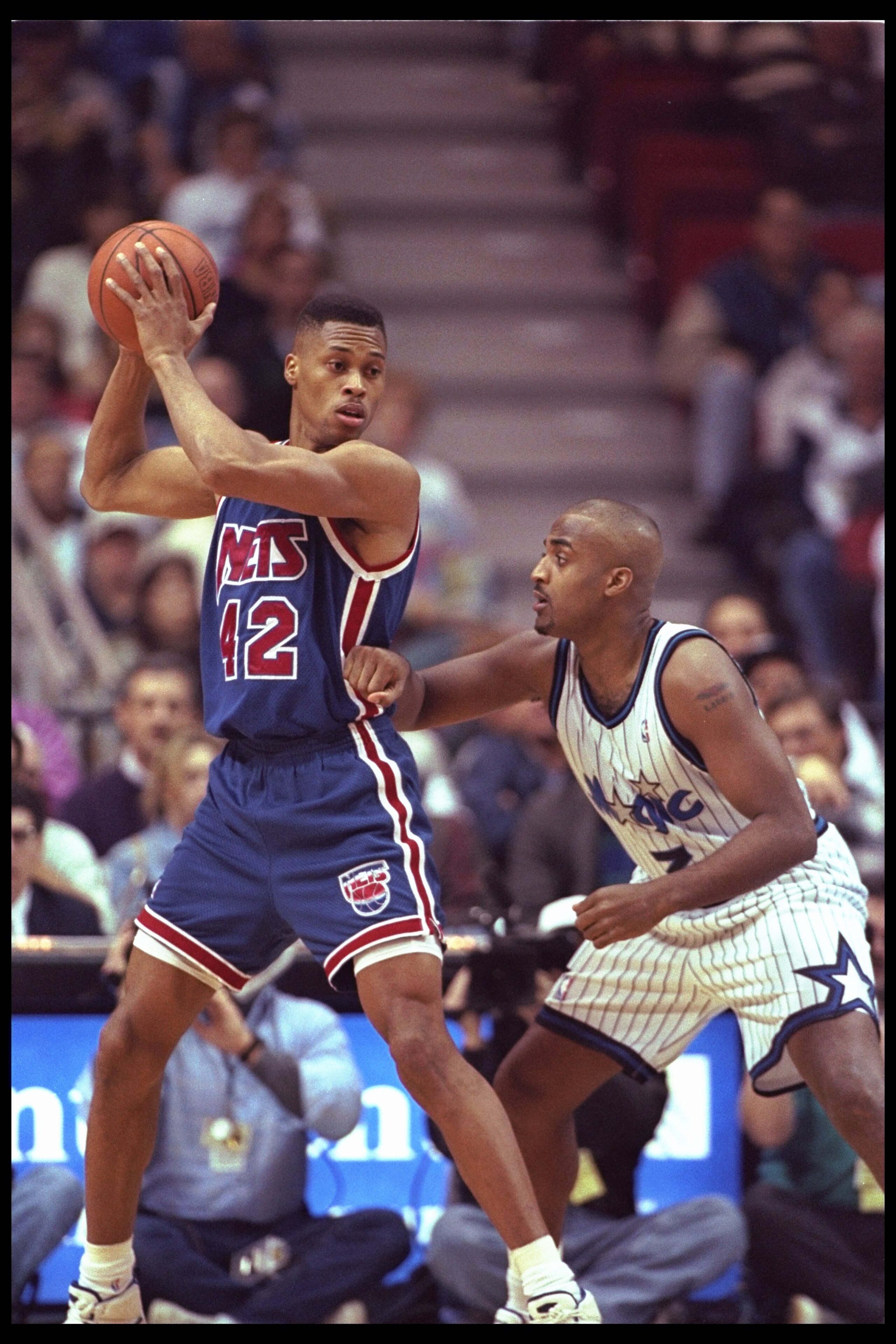 9 Jan 1996:  PJ Brown of the New Jersey Nets looks to pass against forward Dennis Scott of the Orlando Magic during a game played at the   Orlando Arena in Orlando, Florida.  The Magic won the game, 92-84. Mandatory Credit: ALLSPORT USA  /Allsport
