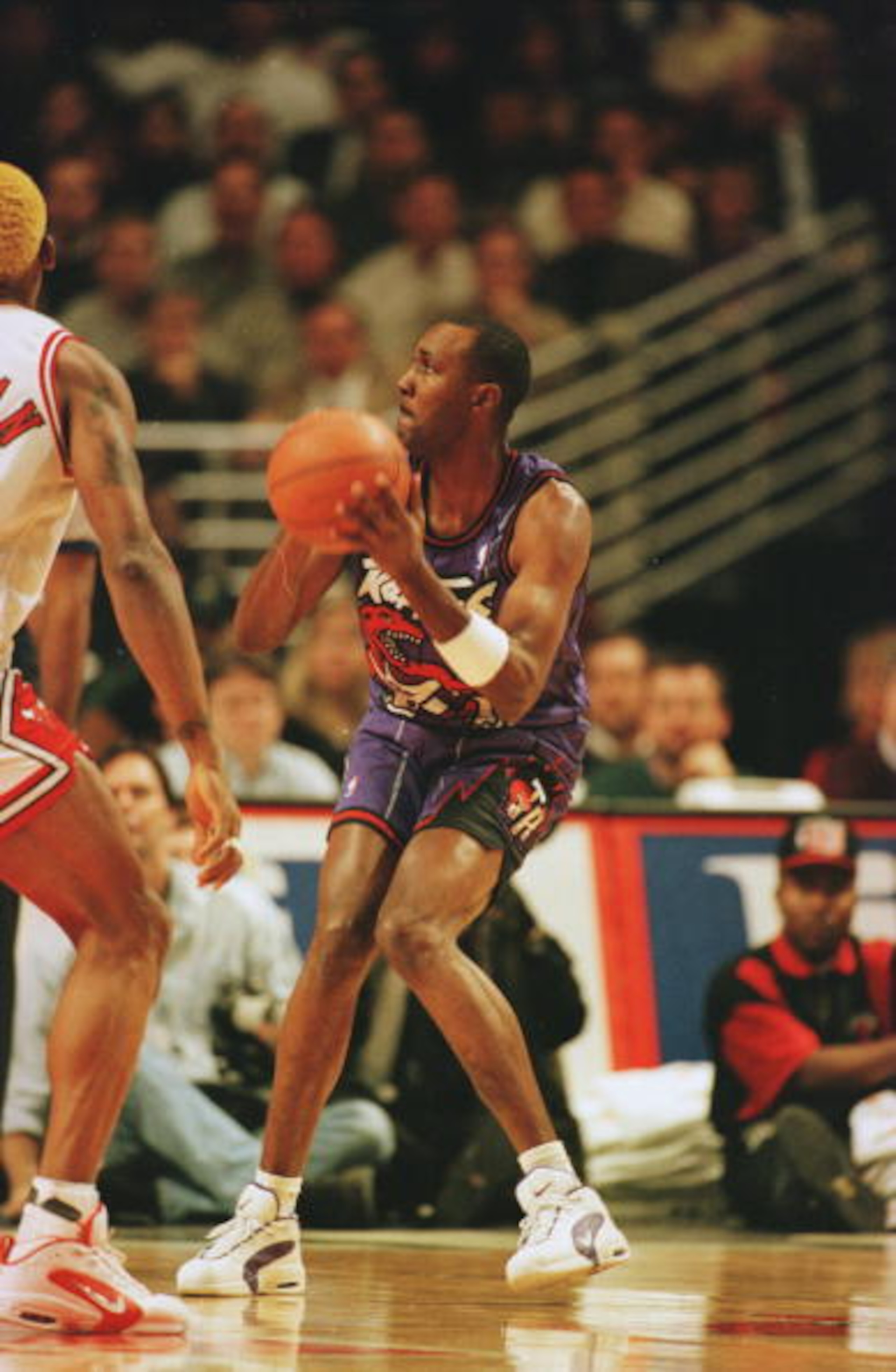 7 Nov 1995:  Guard Jimmy King of the Toronto Raptors focuses on the basket before attempting a shot during the Raptors 117-108 loss to the Chicago Bulls at the United Center in Chicago, Illinois.   Mandatory Credit: Jonathan Daniel/ALLSPORT