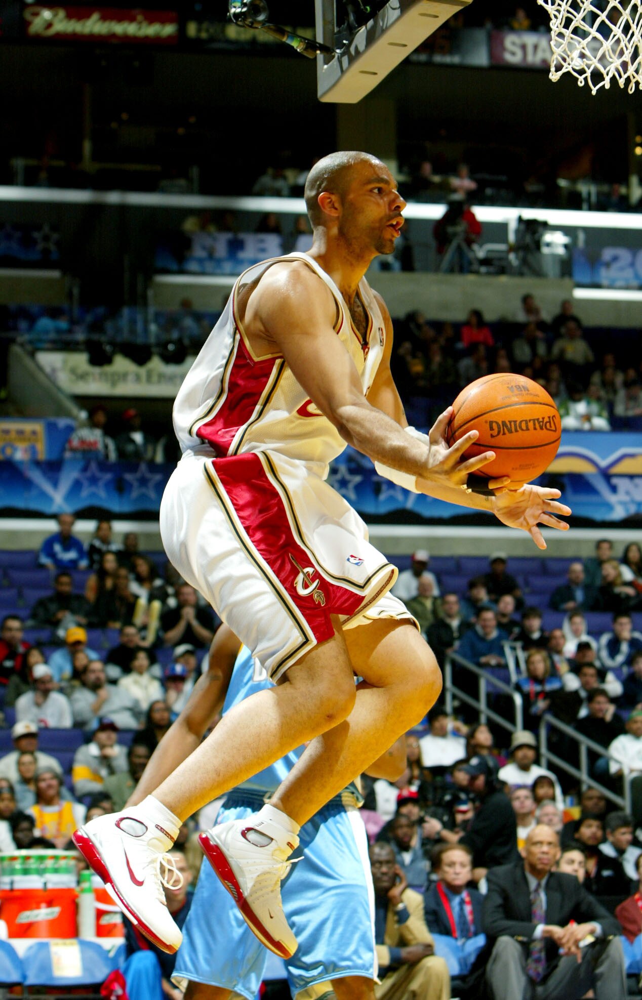 LOS ANGELES - FEBRUARY 13:  Sophomore Carlo Boozer #1 of the Cleveland Cavaliers looks to pass under the basket during the Got Milk? Rookie Challenge, part of the 53rd NBA All-Star weekend at Staples Center on February 13, 2004 in Los Angeles, California.