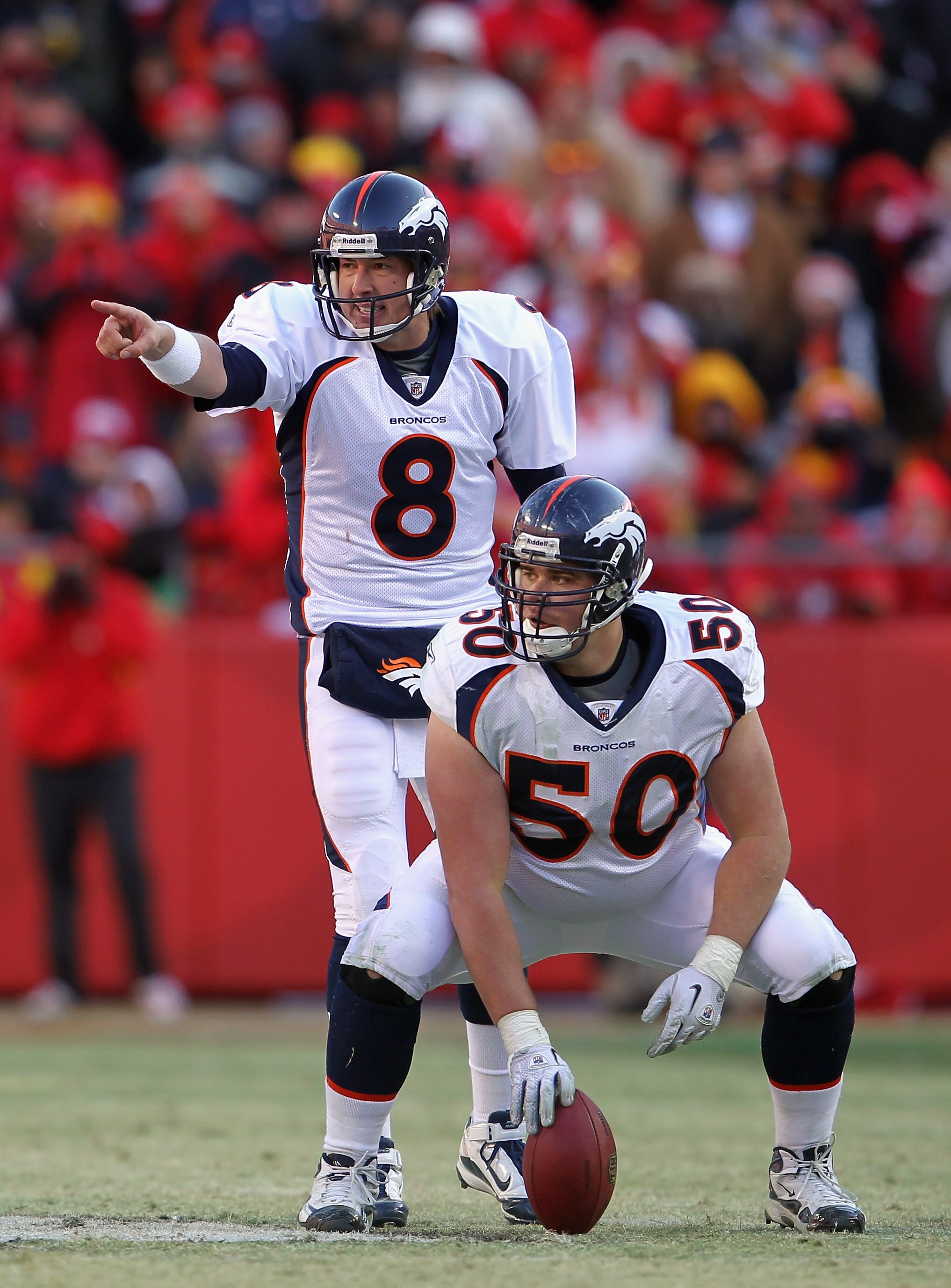 KANSAS CITY, MO - DECEMBER 05:  Quarterback Kyle Orton #8 of the Denver Broncos prepares to take a snap from center J.D. Walton #50 during the game against the Kansas City Chiefs on December 5, 2010 at Arrowhead Stadium in Kansas City, Missouri.  (Photo b