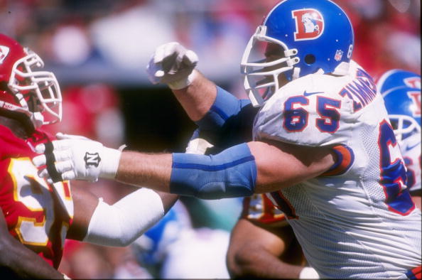 22 Sep 1996: Offensive lineman Gary Zimmerman #65 of the Denver Broncos battles defensive lineman Vaughn Booker of the Kansas City Chiefs during the Broncos 17-14 loss at Arrowhead Stadium in Kansas City, Missouri.