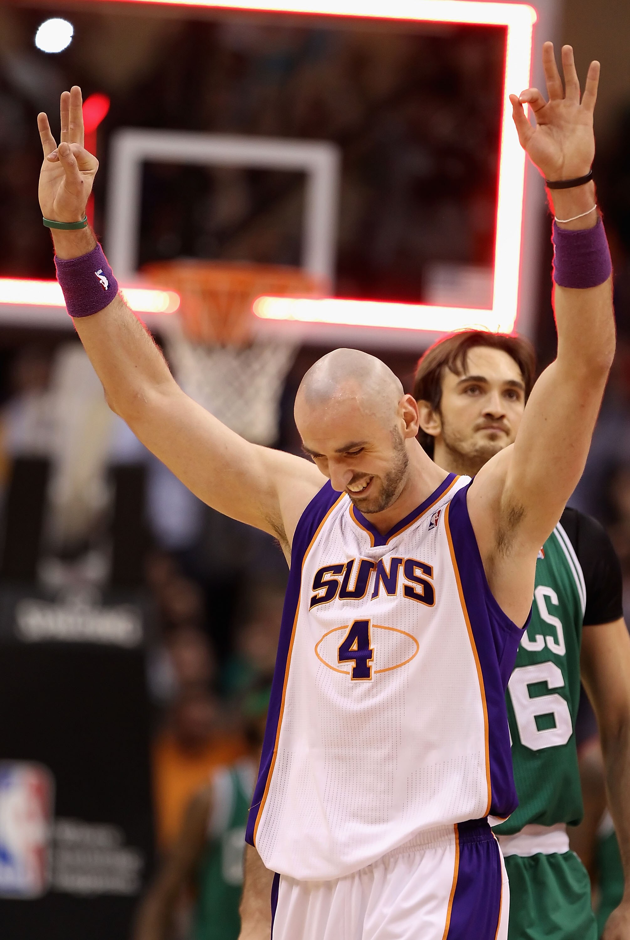 PHOENIX, AZ - JANUARY 28:  Marcin Gortat #4 of the Phoenix Suns reacts after hitting a three point shot at the end of the first quarter against the Boston Celtics during the NBA game at US Airways Center on January 28, 2011 in Phoenix, Arizona. The Suns d