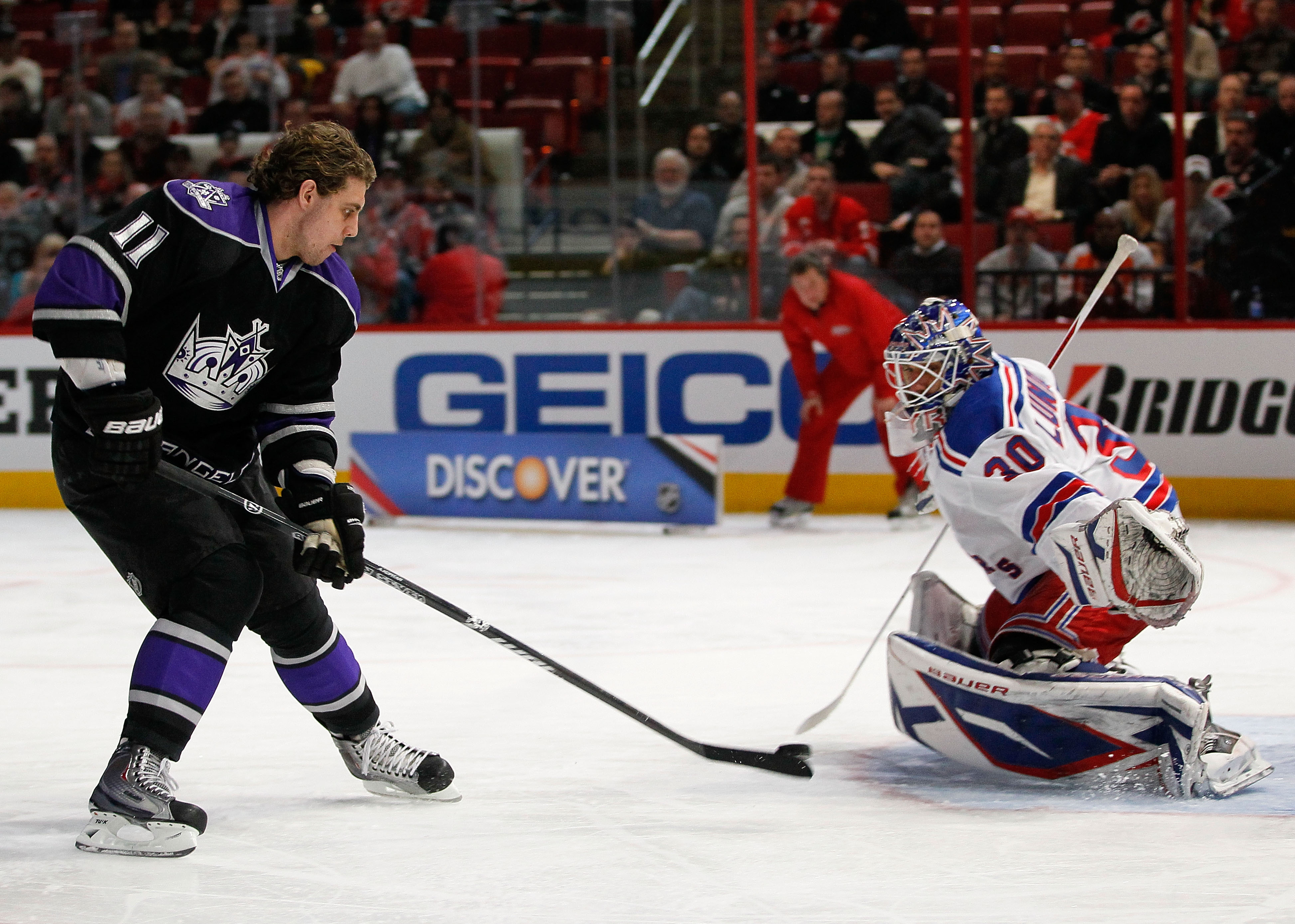 RALEIGH, NC - JANUARY 29:  Anze Kopitar #11 of the Los Angeles Kings shoots on Henrik Lundqvist #30 of New York Rangers during the elimination shootout in the Honda NHL SuperSkills competition part of 2011 NHL All-Star Weekend at the RBC Center on January