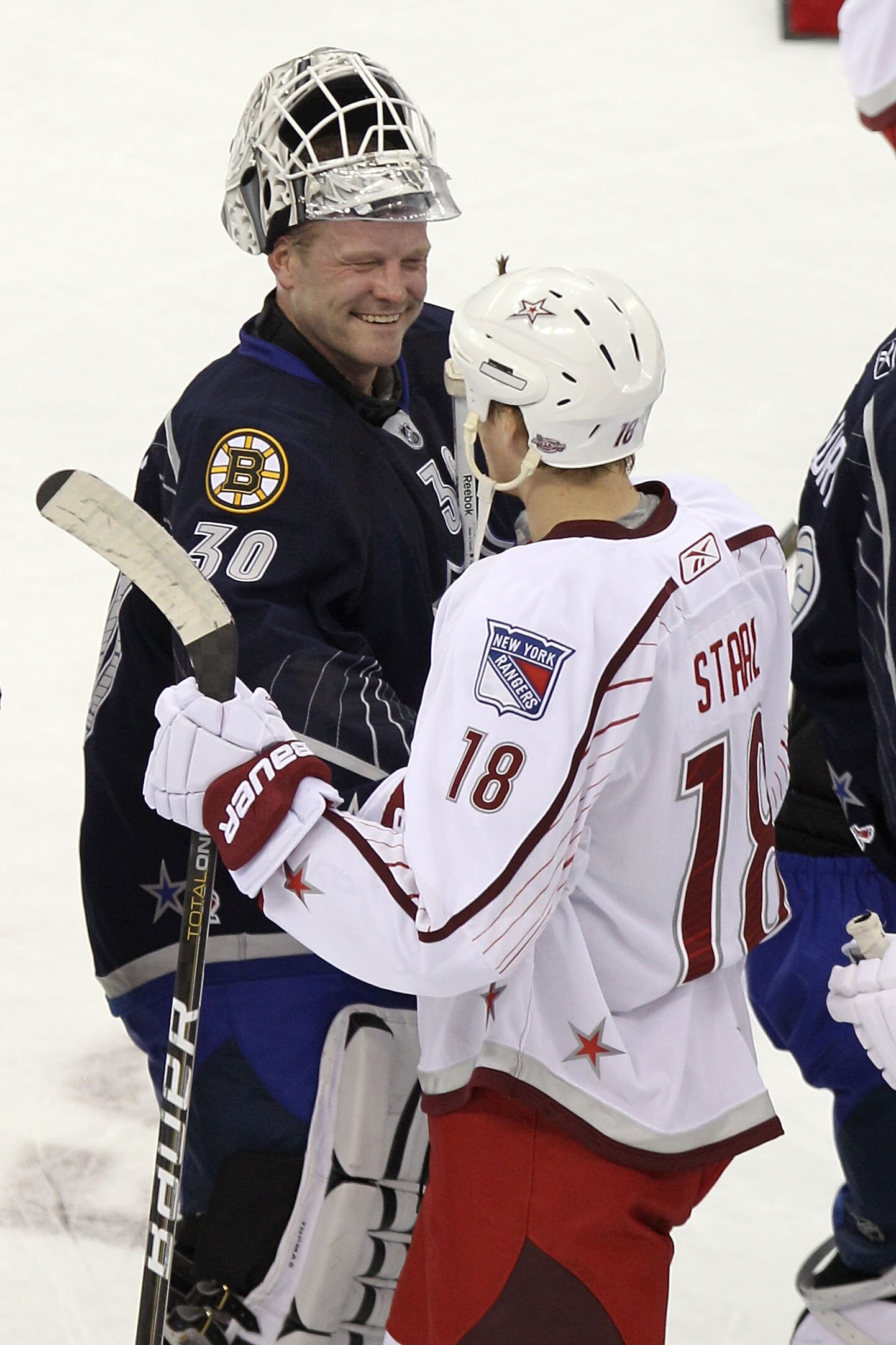 RALEIGH, NC - JANUARY 30:  Tim Thomas #30 of the Boston Bruins and Team Lidstrom talks to Marc Staal #18 of the New York Rangers and Team Staal after Team Lidstrom defeated Team Staal 11 to 10 in the 58th NHL All-Star Game at RBC Center on January 30, 201