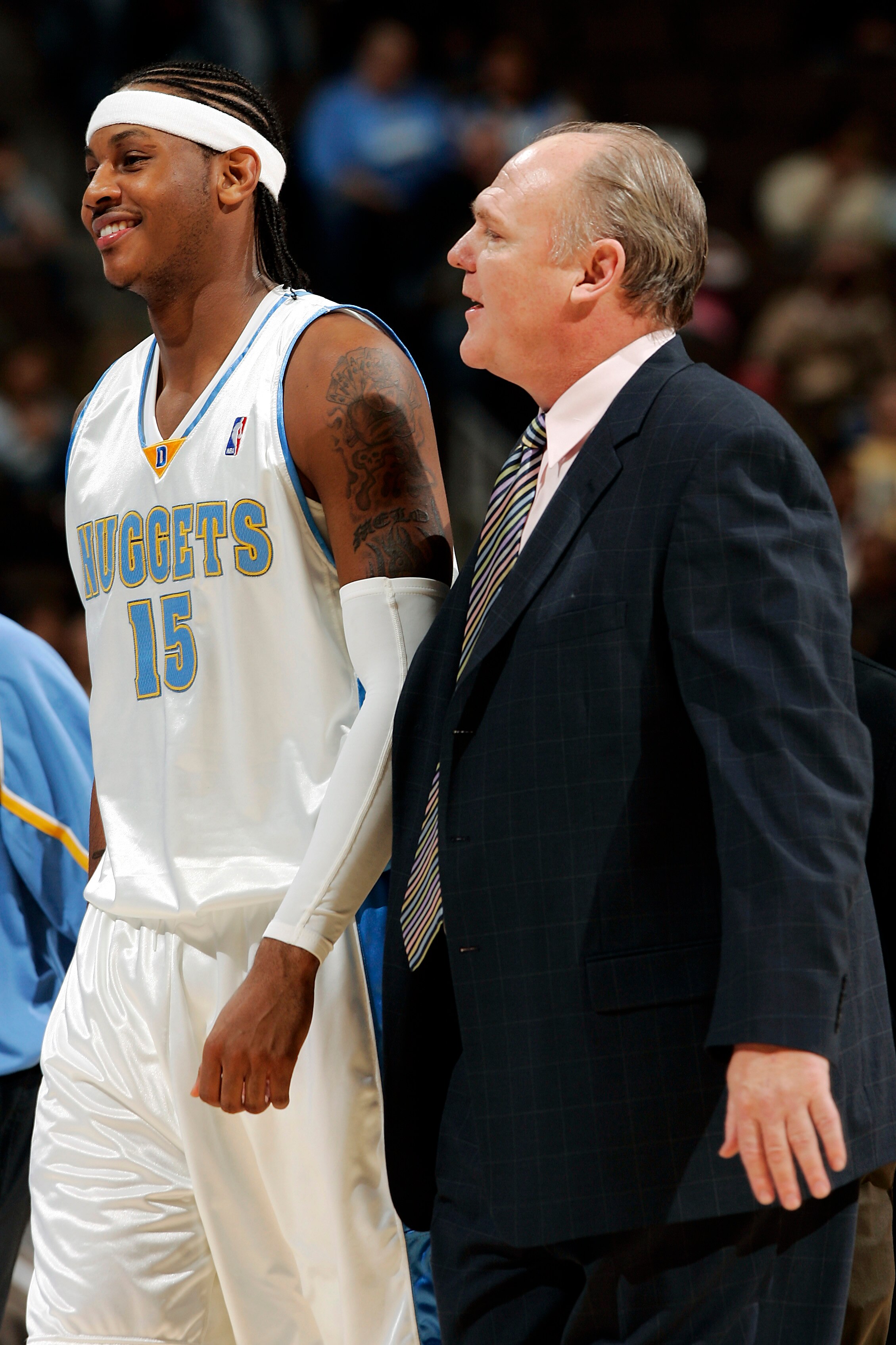 DENVER, CO - NOVEMBER 9:  Carmelo Anthony #15 of the Denver Nuggets shares a laugh with head coach George Karl against the Sacramento Kings in the fourth quarter on November 9, 2005 at the Pepsi Center in Denver, Colorado.  The Nuggets won 107-91.  (Photo
