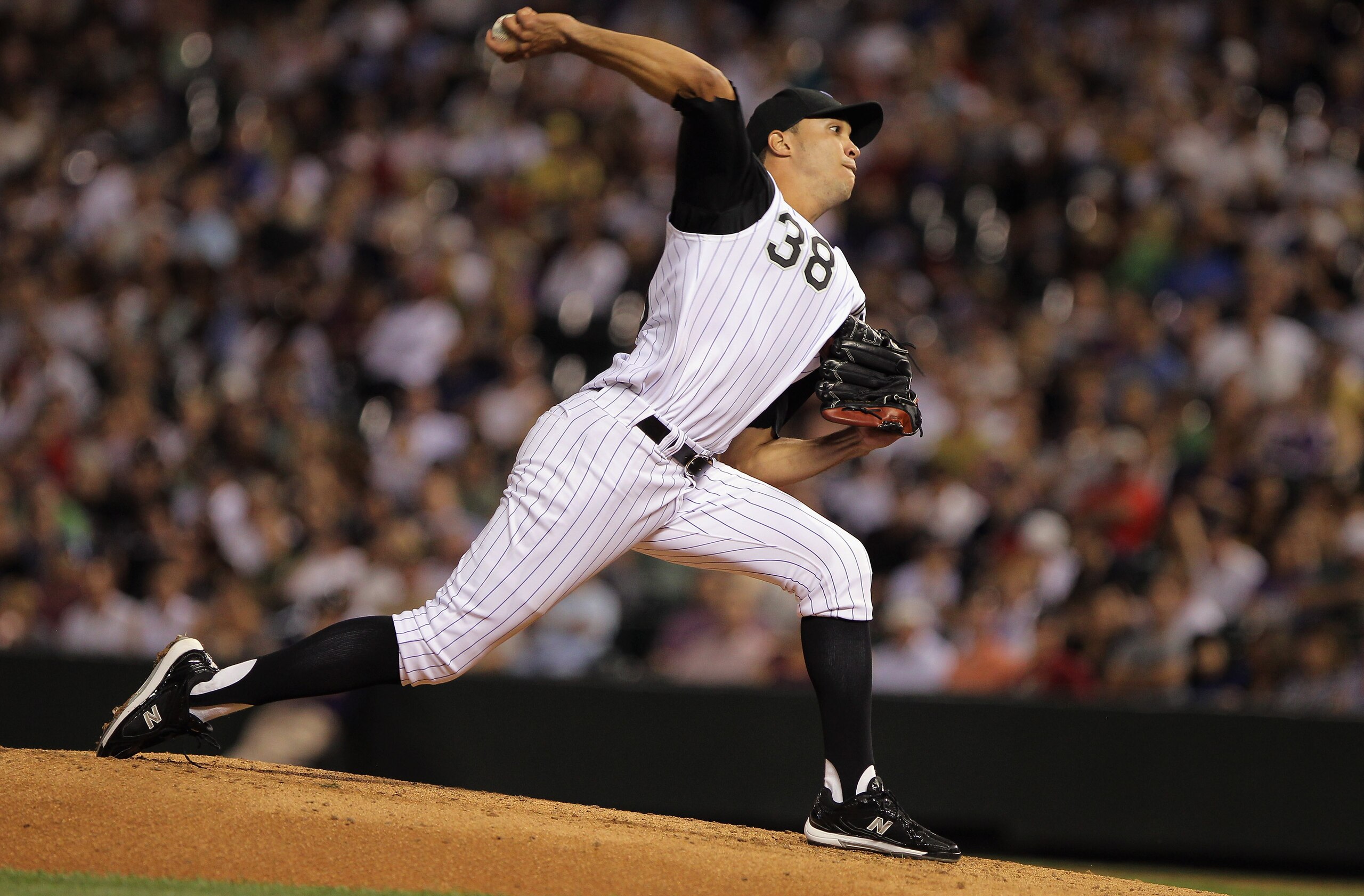 DENVER - SEPTEMBER 27:  Starting pitcher Ubaldo Jimenez #38 of the Colorado Rockies works against the Los Angeles Dodgers at Coors Field on September 25, 2010 in Denver, Colorado. Jiimenez failed to earn his 20th win of the season as the Dodgers defeated