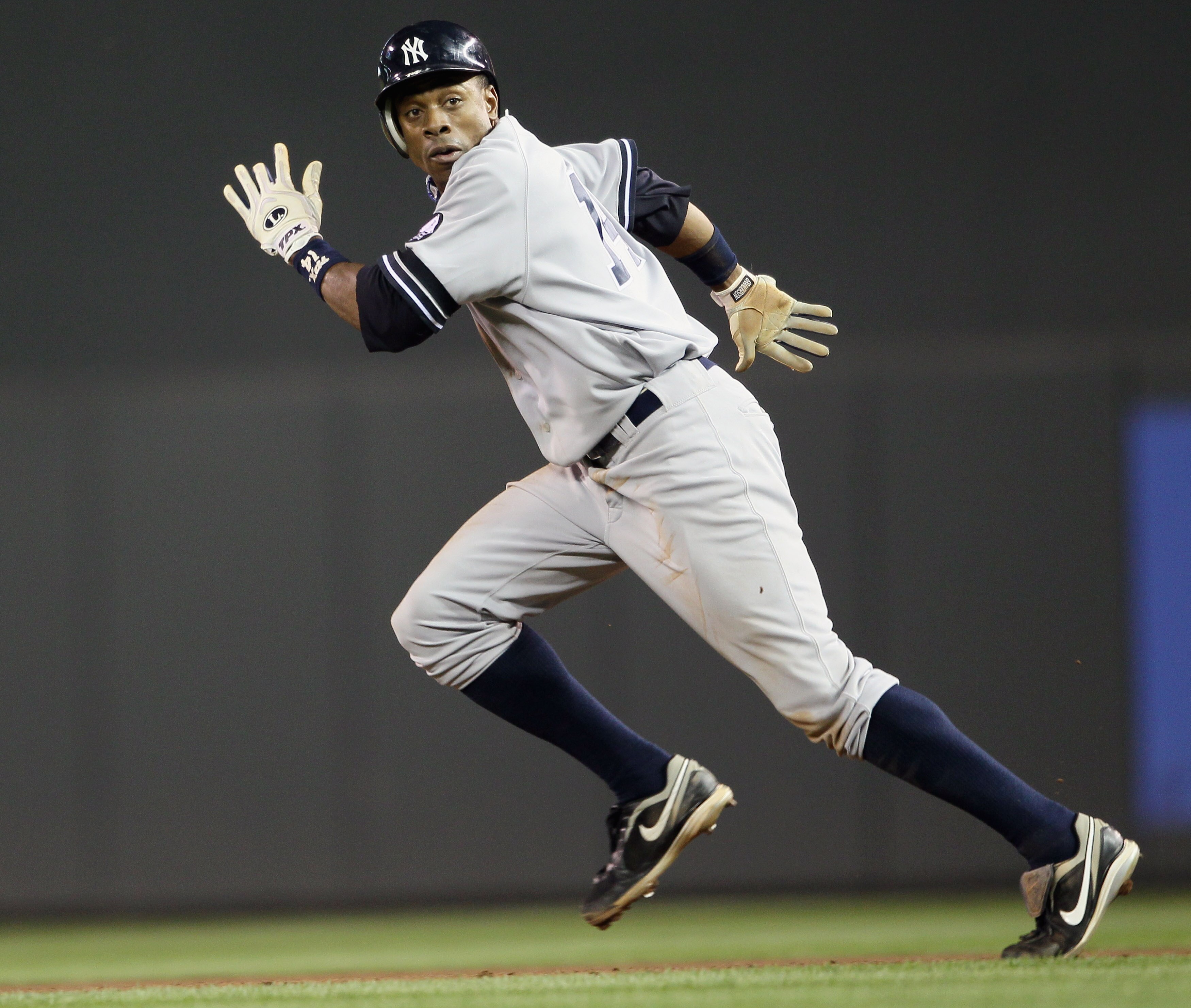 MINNEAPOLIS - OCTOBER 07:  Curtis Granderson #14 of the New York Yankees runs to second base against the Minnesota Twins during game two of the ALDS on October 7, 2010 at Target Field in Minneapolis, Minnesota. The Yankees beat the Twins 5-2.(Photo by Els