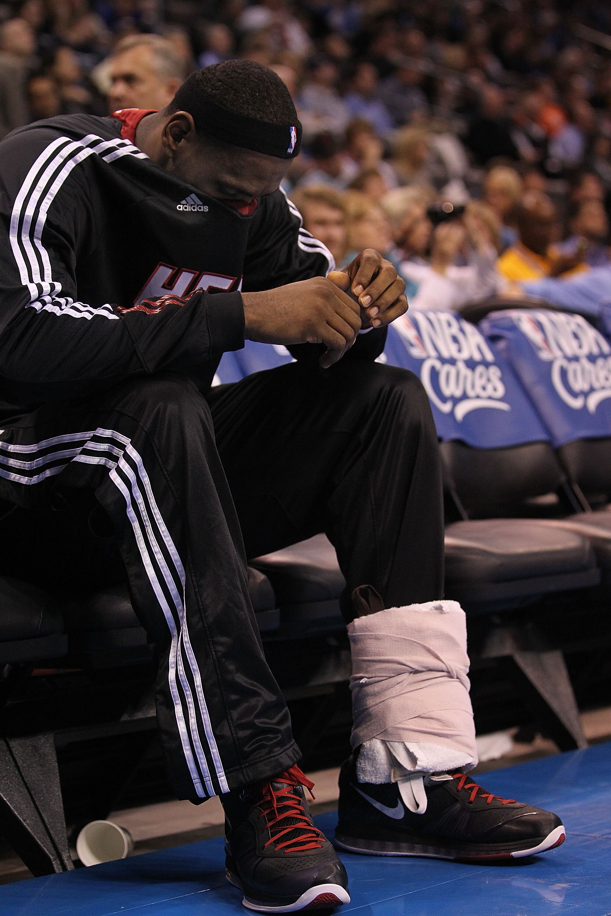 OKLAHOMA CITY, OK - JANUARY 30:  LeBron James #6 of the Miami Heat on the bench with his wrapped ankle during play against the Oklahoma City Thunder at Ford Center on January 30, 2011 in Oklahoma City, Oklahoma.  NOTE TO USER: User expressly acknowledges
