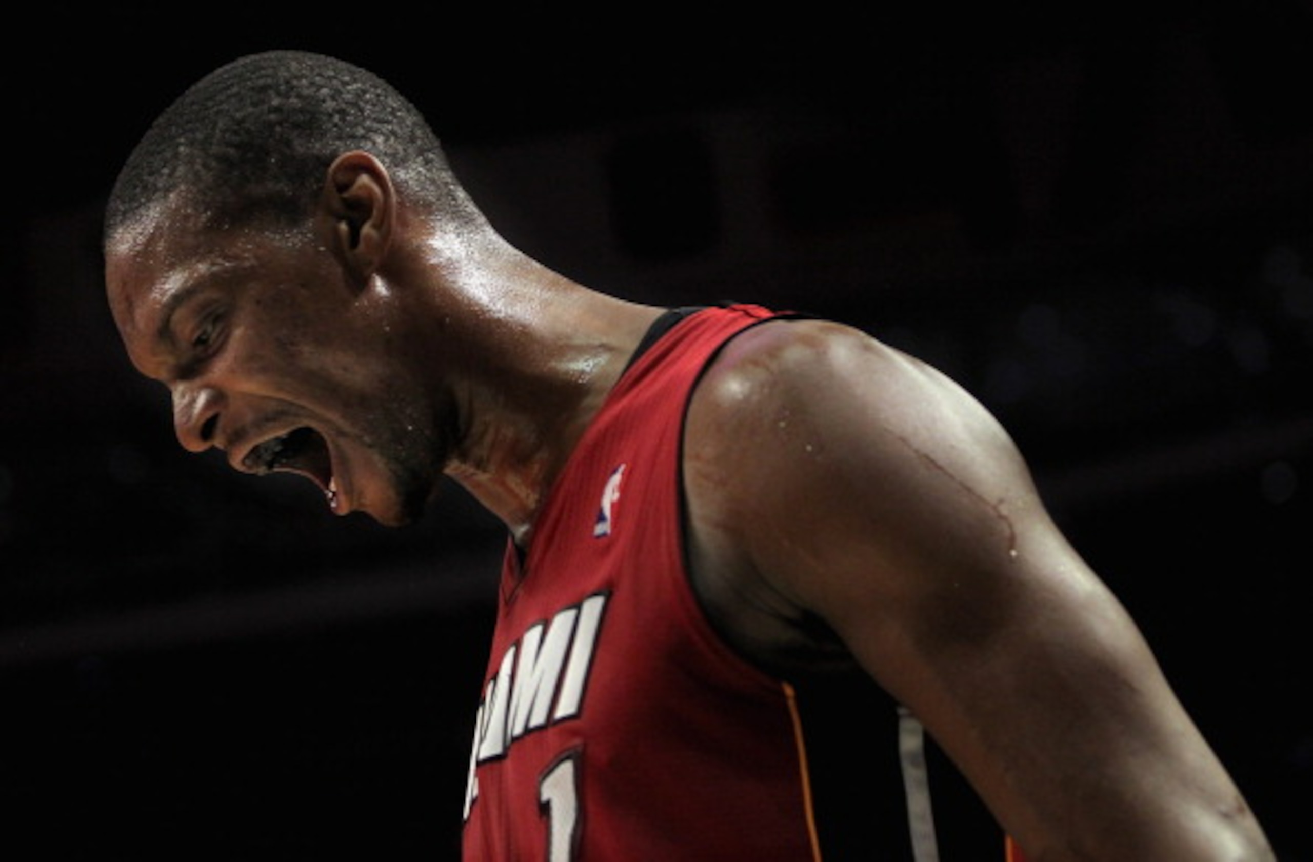 CHICAGO, IL - JANUARY 15: Chris Bosh #1 of the Miami Heat reacts after a play against the Chicago Bulls at the United Center on January 15, 2011 in Chicago, Illinois. The Bulls defeated the Heat 99-96. NOTE TO USER: User expressly acknowledges and agrees CHICAGO, IL - JANUARY 15: Chris Bosh #1 of the Miami Heat reacts after a play against the Chicago Bulls at the United Center on January 15, 2011 in Chicago, Illinois. The Bulls defeated the Heat 99-96. NOTE TO USER: User expressly acknowledges and agrees