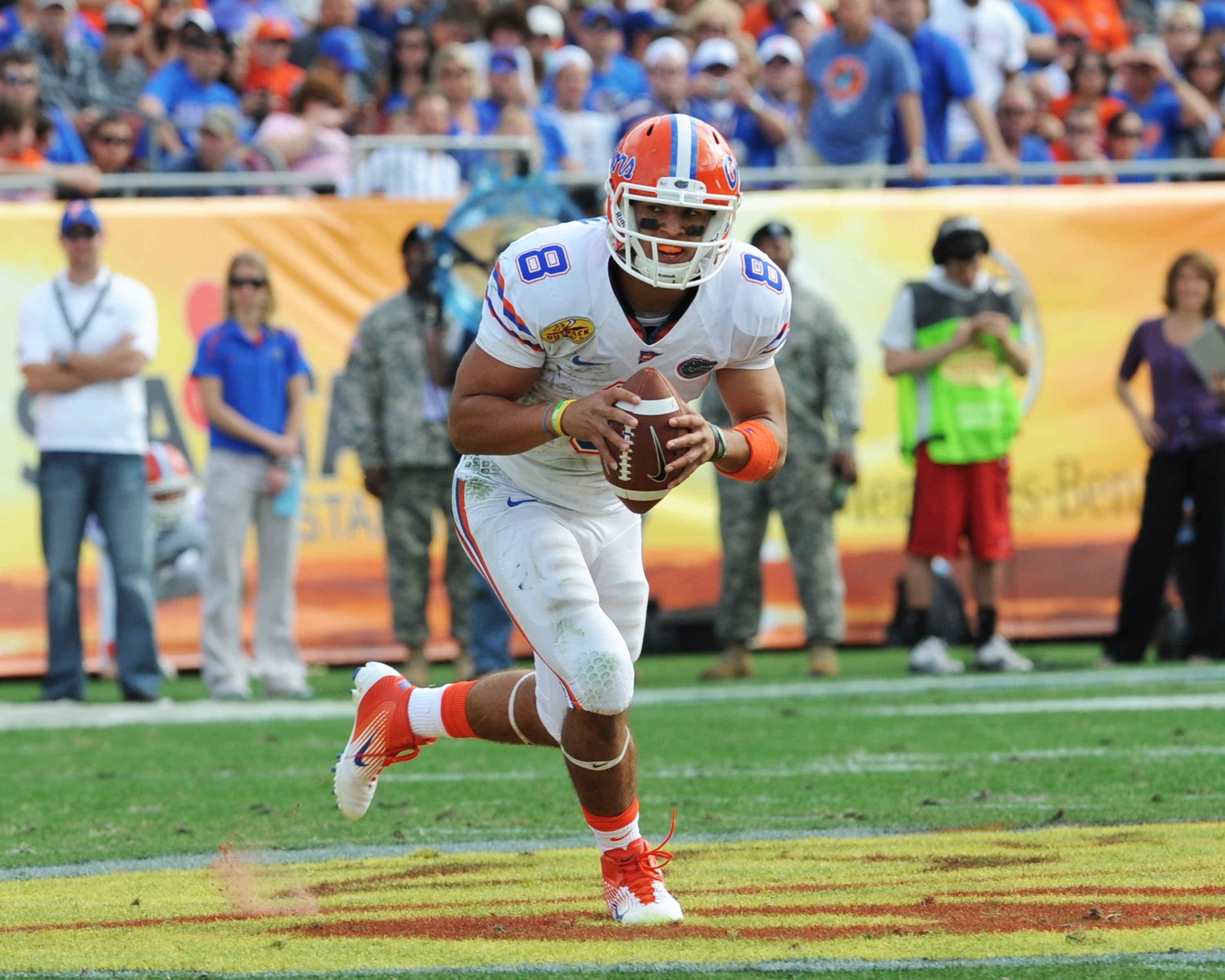 TAMPA, FL - JANUARY 1:  Quarterback Trey Burton #8  of the Florida Gators rushes upfield against the Penn State Nittany Lions January 1, 2010 in the 25th Outback Bowl at Raymond James Stadium in Tampa, Florida.  (Photo by Al Messerschmidt/Getty Images)
