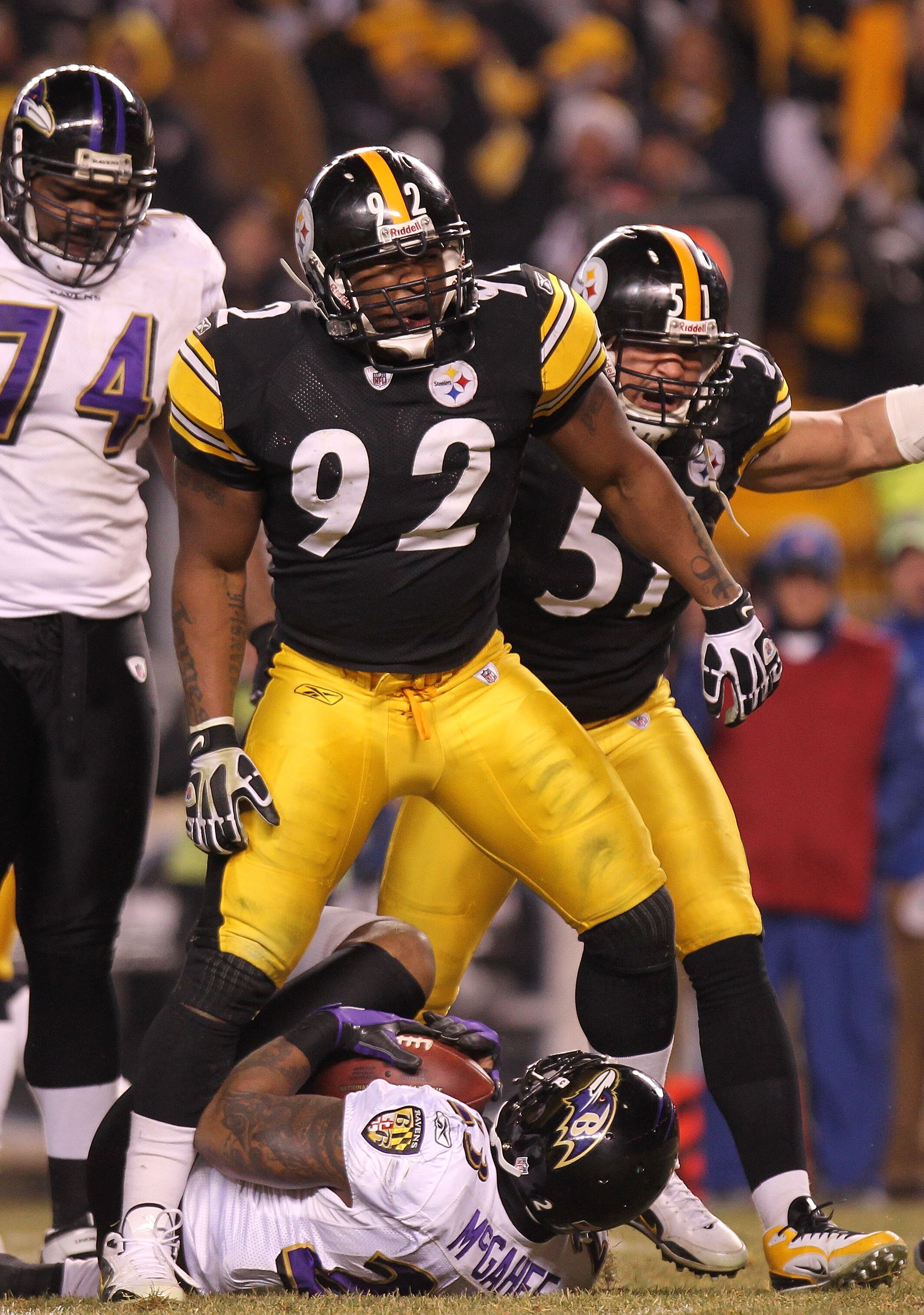 PITTSBURGH, PA - JANUARY 15:  Linebacker James Harrison #92 of the Pittsburgh Steelers celebrates after stopping running back Willis McGahee #23 of the Baltimore Ravens on a play during the AFC Divisional Playoff Game at Heinz Field on January 15, 2011 in