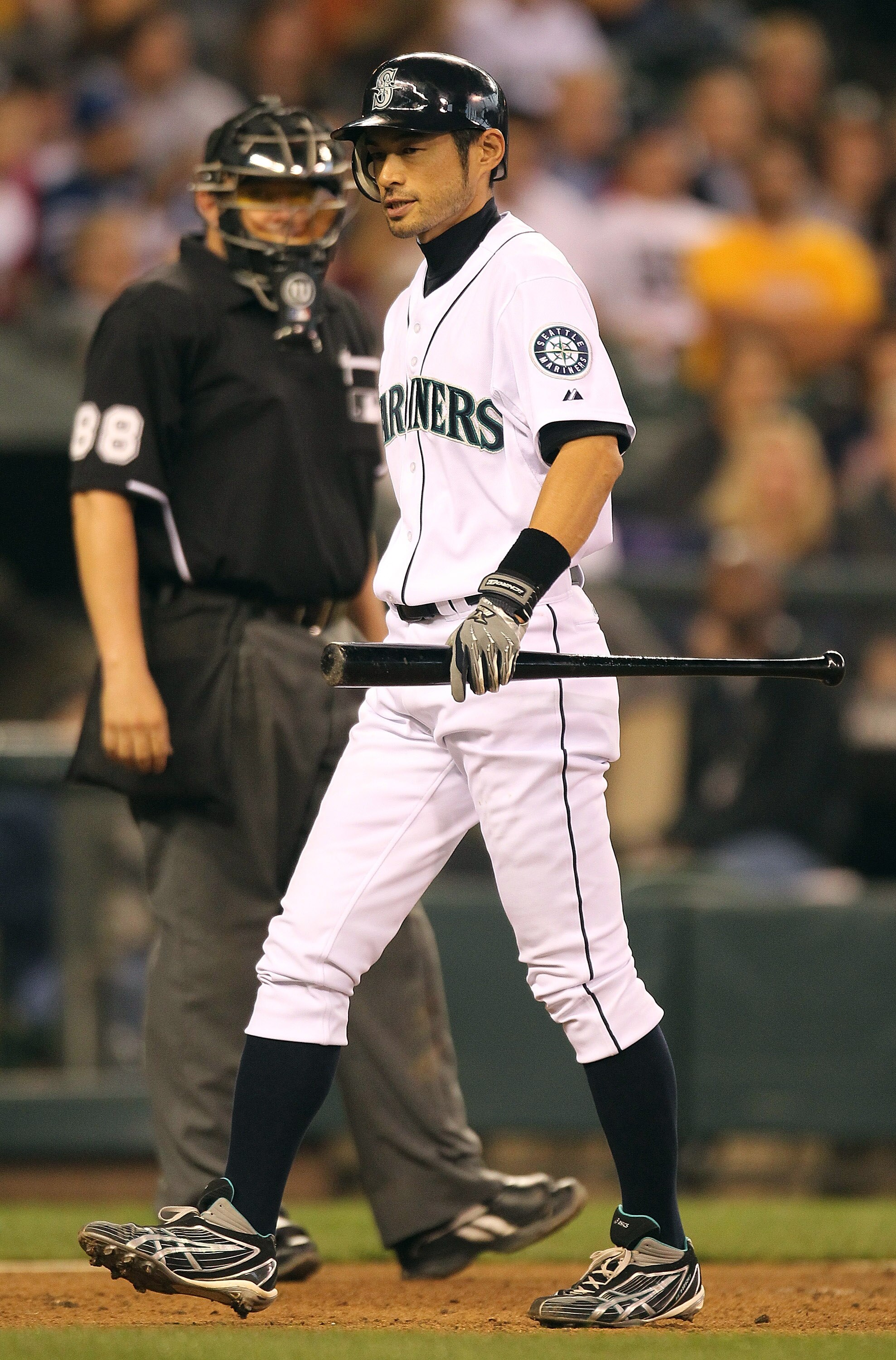 SEATTLE - SEPTEMBER 15:  Ichiro Suzuki #51 of the Seattle Mariners heads back to the dugout after taking a called third strike by home plate umpire Doug Eddings in the sixth inning of the game against the Boston Red Sox at Safeco Field on September 15, 20