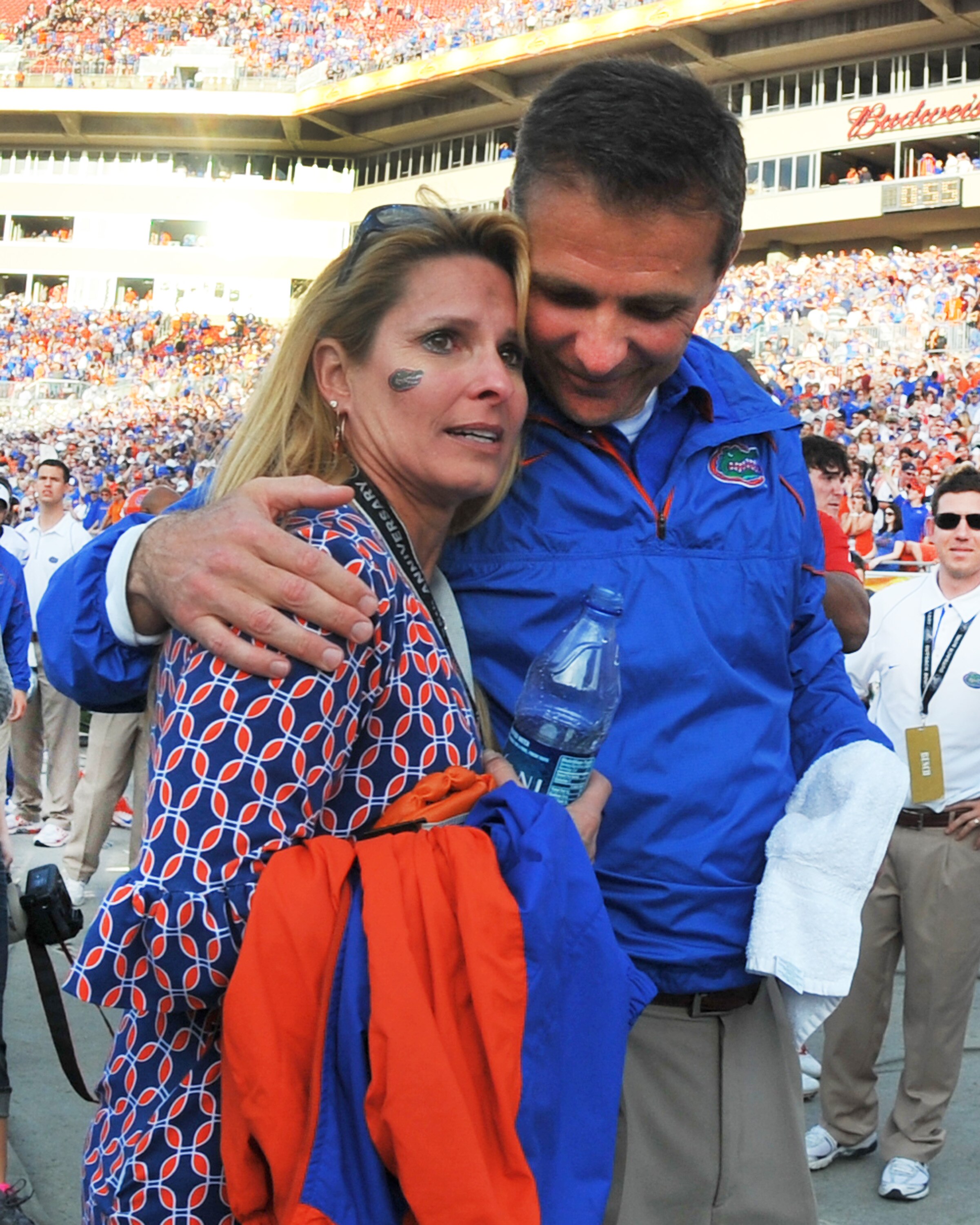 TAMPA, FL - JANUARY 1:  Coach Urban Meyer of the Florida Gators hugs his wife, Shelley, after play against the Penn State Nittany Lions January 1, 2011 in the 25th Outback Bowl at Raymond James Stadium in Tampa, Florida.  (Photo by Al Messerschmidt/Getty