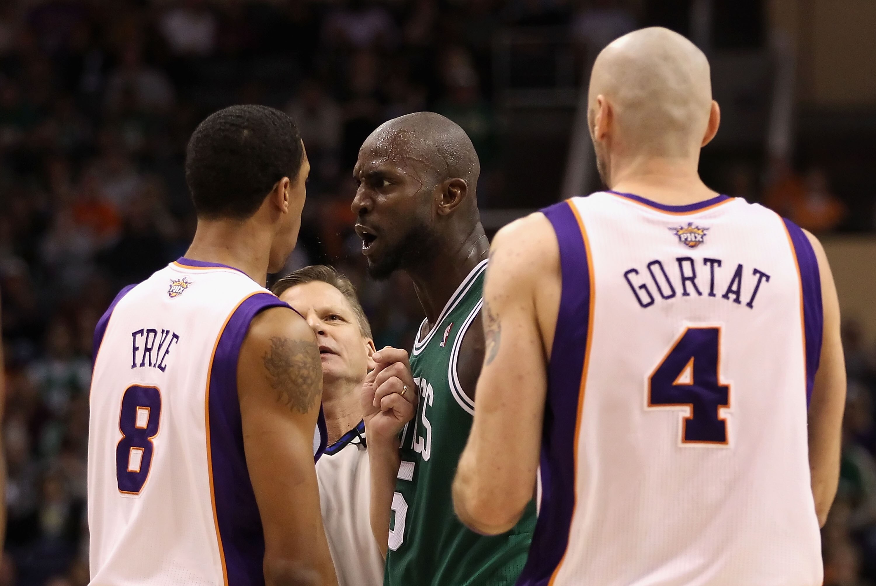 PHOENIX, AZ - JANUARY 28:  Kevin Garnett #5 of the Boston Celtics stares down Channing Frye #8 of the Phoenix Suns after Garnett was called for a technical foul during the NBA game at US Airways Center on January 28, 2011 in Phoenix, Arizona.  The Suns de