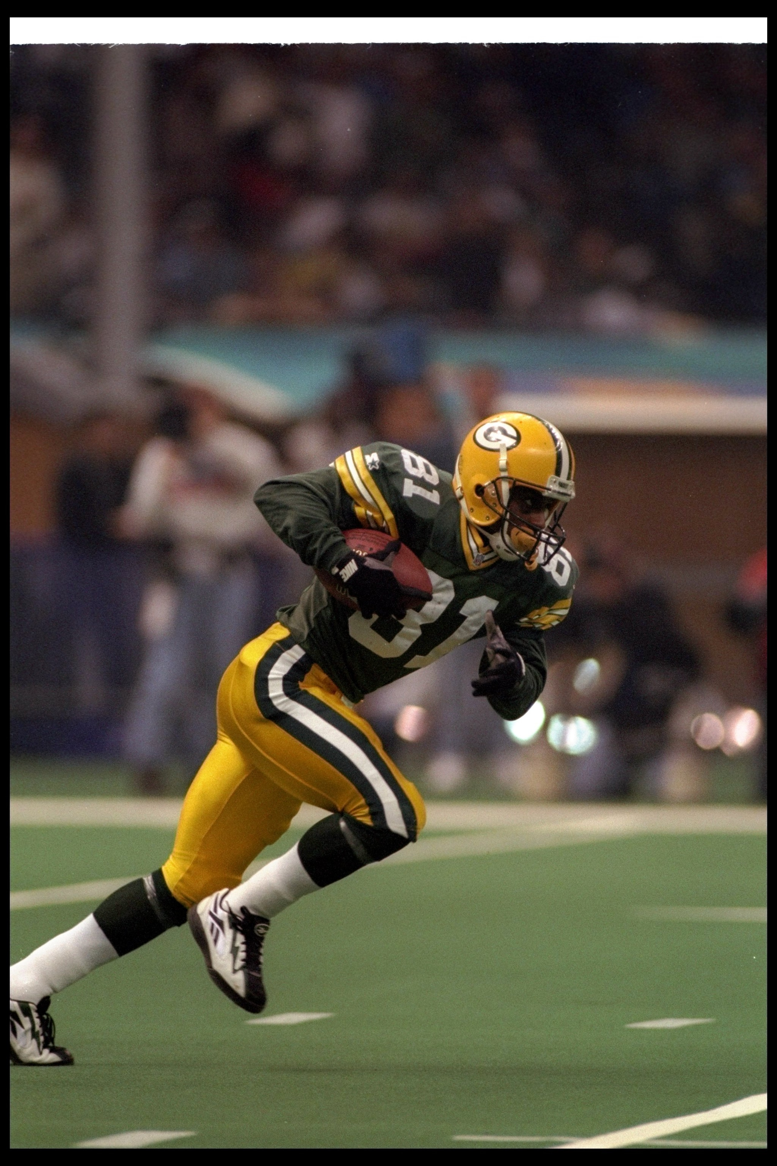 26 Jan 1997:  Wide receiver Desmond Howard of the Green Bay Packers moves the ball during Super Bowl XXXI against the New England Patriots at the Superdome in New Orleans, Louisiana.  The Packers won the game, 35-21. Mandatory Credit: Rick Stewart  /Allsp