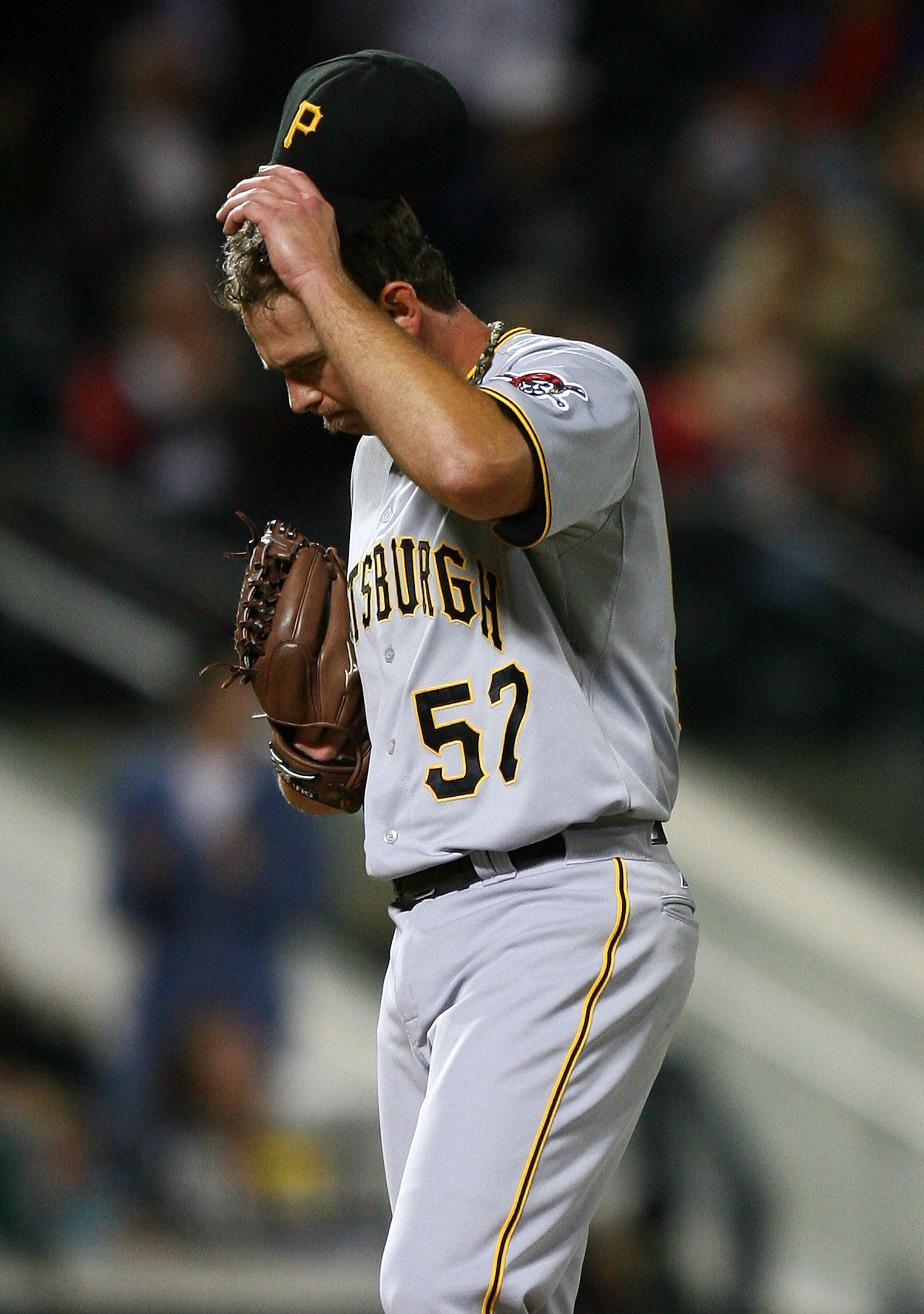NEW YORK - SEPTEMBER 14:  Zach Duke #57 of the Pittsburgh Pirates reacts after allowing a home run against the New York Mets on September 14, 2010 at Citi Field in the Flushing neighborhood of the Queens borough of New York City.  (Photo by Andrew Burton/