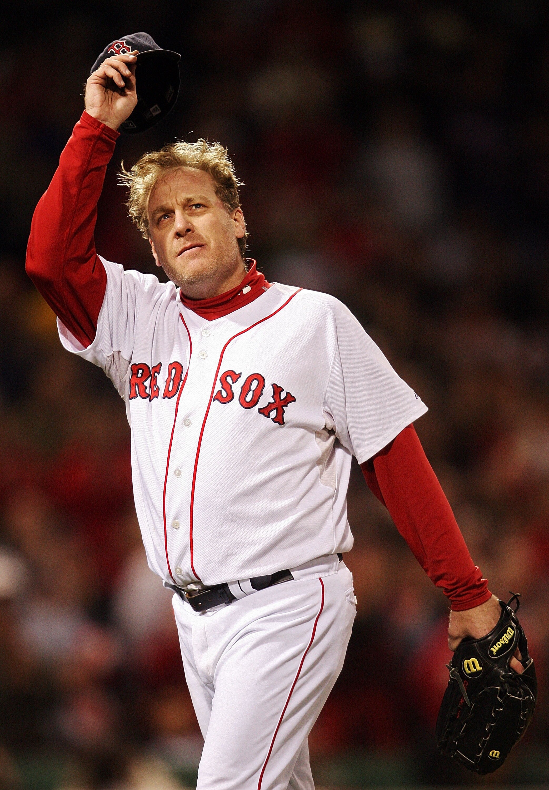 BOSTON - OCTOBER 25:  Curt Schilling #38 of the Boston Red Sox tips his hat to the crowd as he comes out of the game in the sixth inning against the Colorado Rockies during Game Two of the 2007 Major League Baseball World Series at Fenway Park on October 