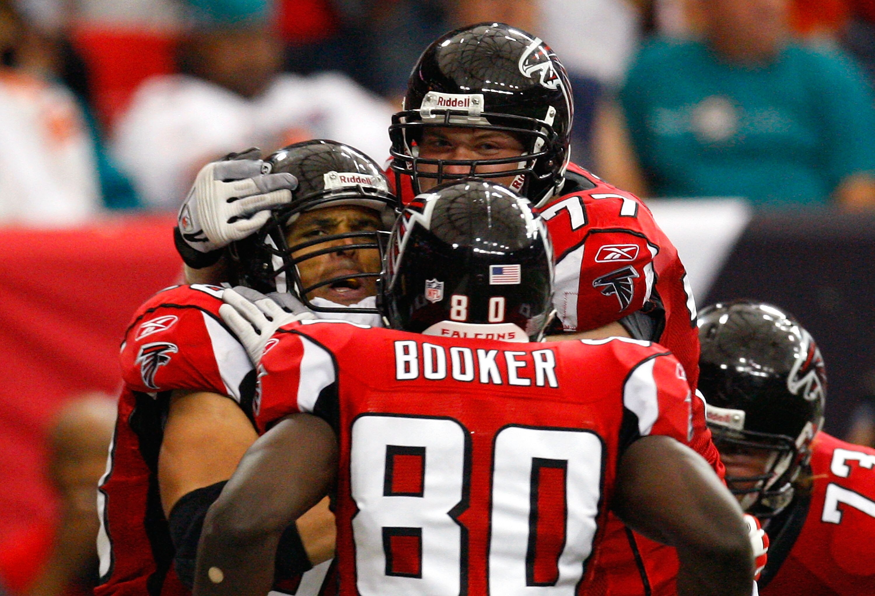 ATLANTA - SEPTEMBER 13:  Tony Gonzalez #88 of the Atlanta Falcons celebrates his touchdown against the Miami Dolphins with Marty Booker #80 and Tyson Clabo #77 at Georgia Dome on September 13, 2009 in Atlanta, Georgia.  (Photo by Kevin C. Cox/Getty Images