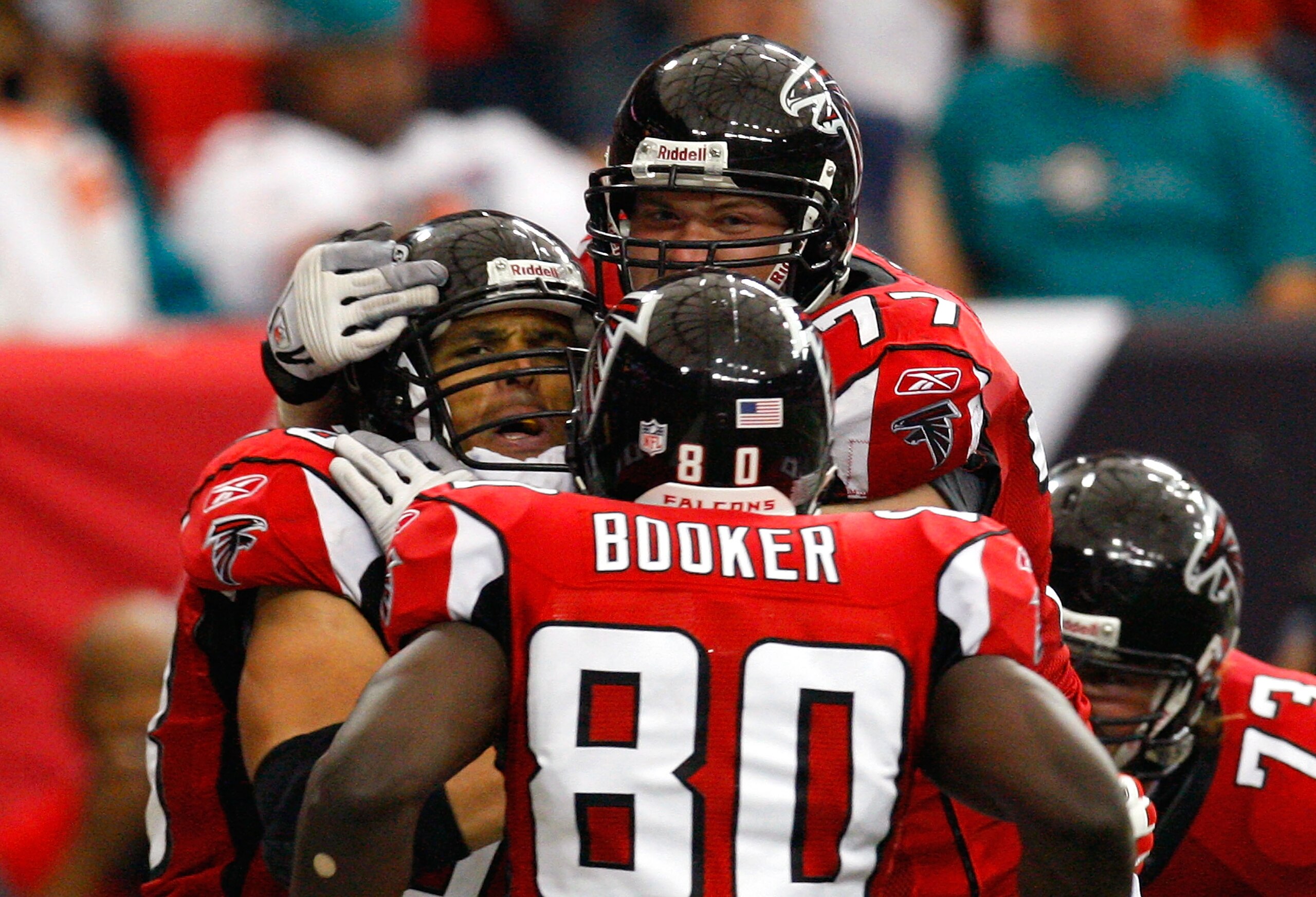 ATLANTA - SEPTEMBER 13:  Tony Gonzalez #88 of the Atlanta Falcons celebrates his touchdown against the Miami Dolphins with Marty Booker #80 and Tyson Clabo #77 at Georgia Dome on September 13, 2009 in Atlanta, Georgia.  (Photo by Kevin C. Cox/Getty Images