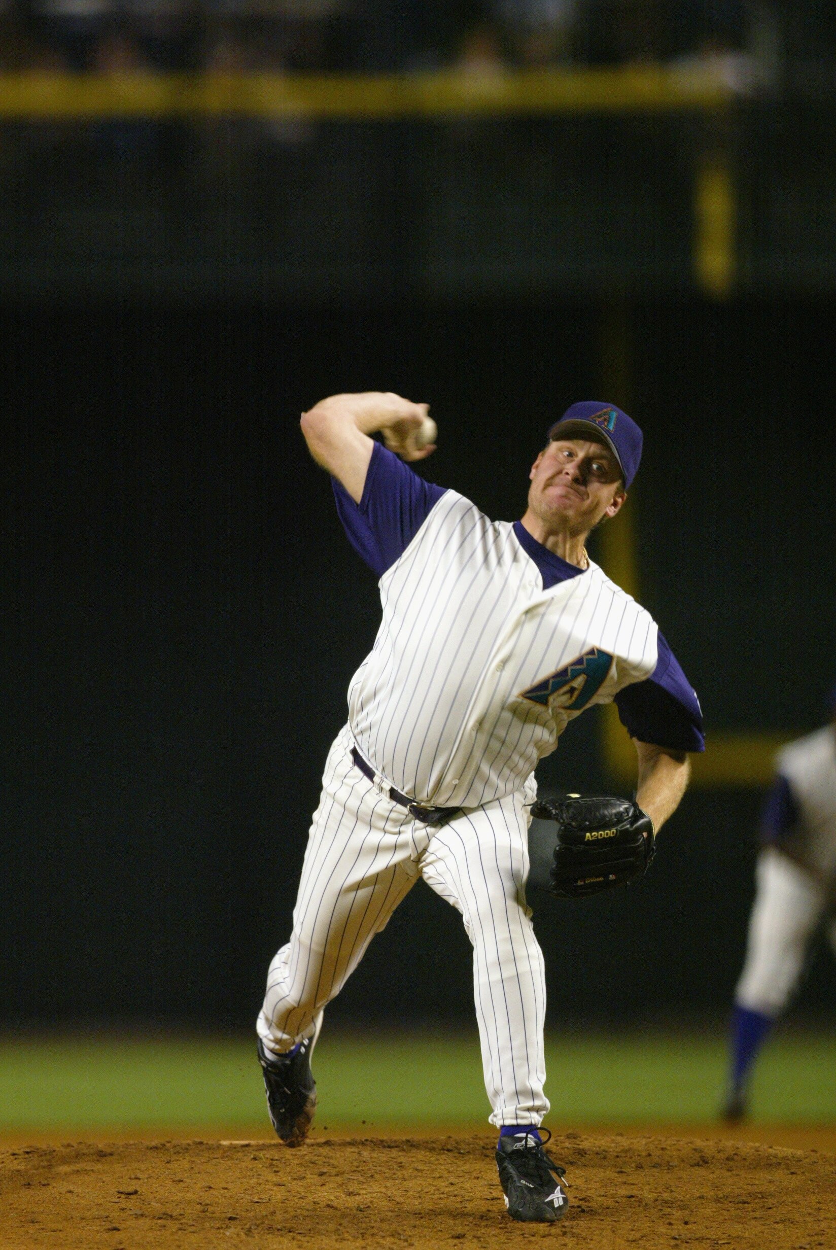 PHOENIX - APRIL 2:  Pitcher Curt Schilling #38 of the Arizona Diamondbacks throws a pitch during the MLB game against the San Diego Padres at Bank One Ball Park in Phoenix, Arizona on April 2, 2002. The Diamondbacks won 9-0. (Photo by Donald Miralle/Getty