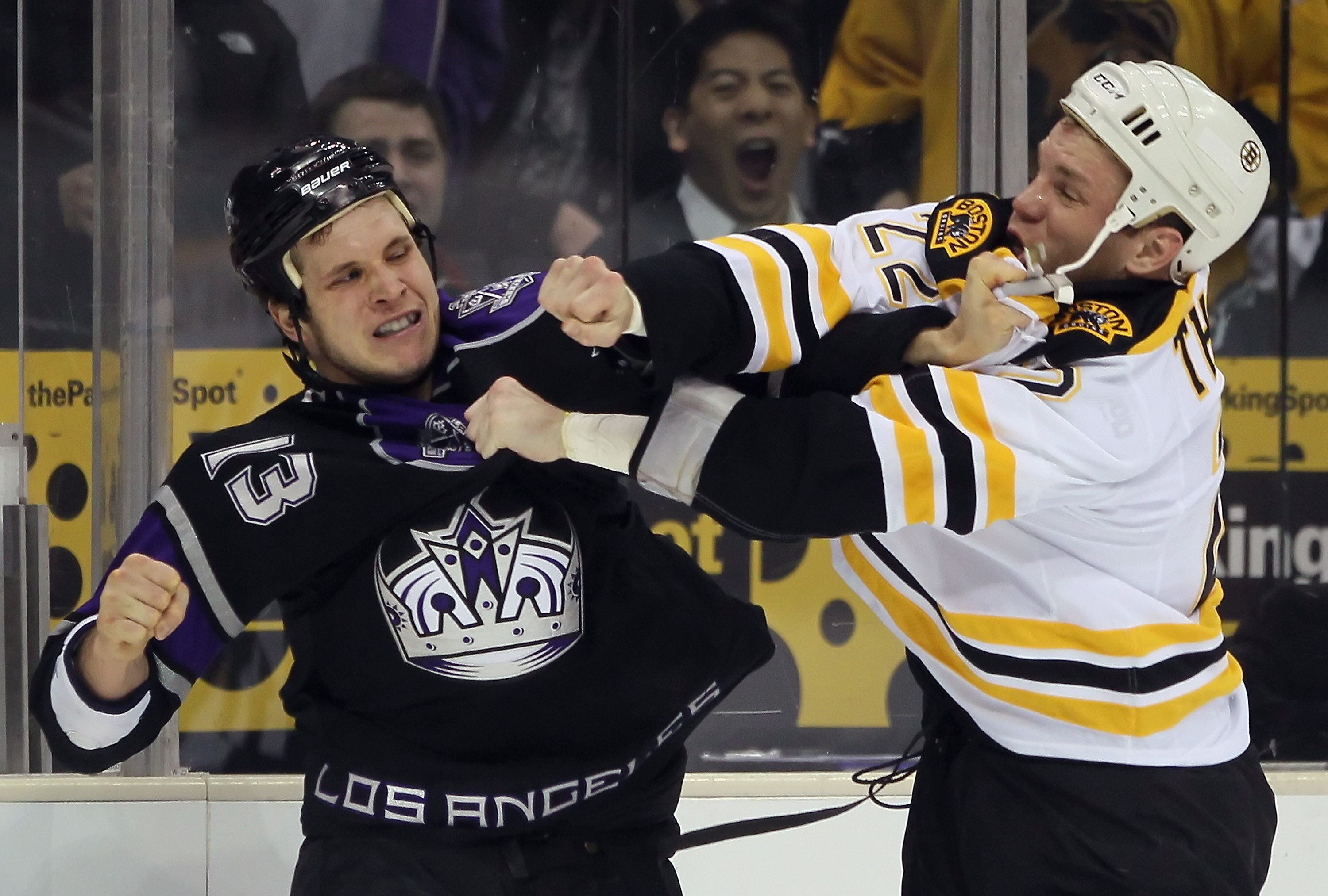 LOS ANGELES, CA - JANUARY 24:  Shawn Thornton #22 of the Boston Bruins and Kyle Clifford #13 of the Los Angeles Kings fight during the first period at Staples Center on January 24, 2011 in Los Angeles, California.  (Photo by Jeff Gross/Getty Images)