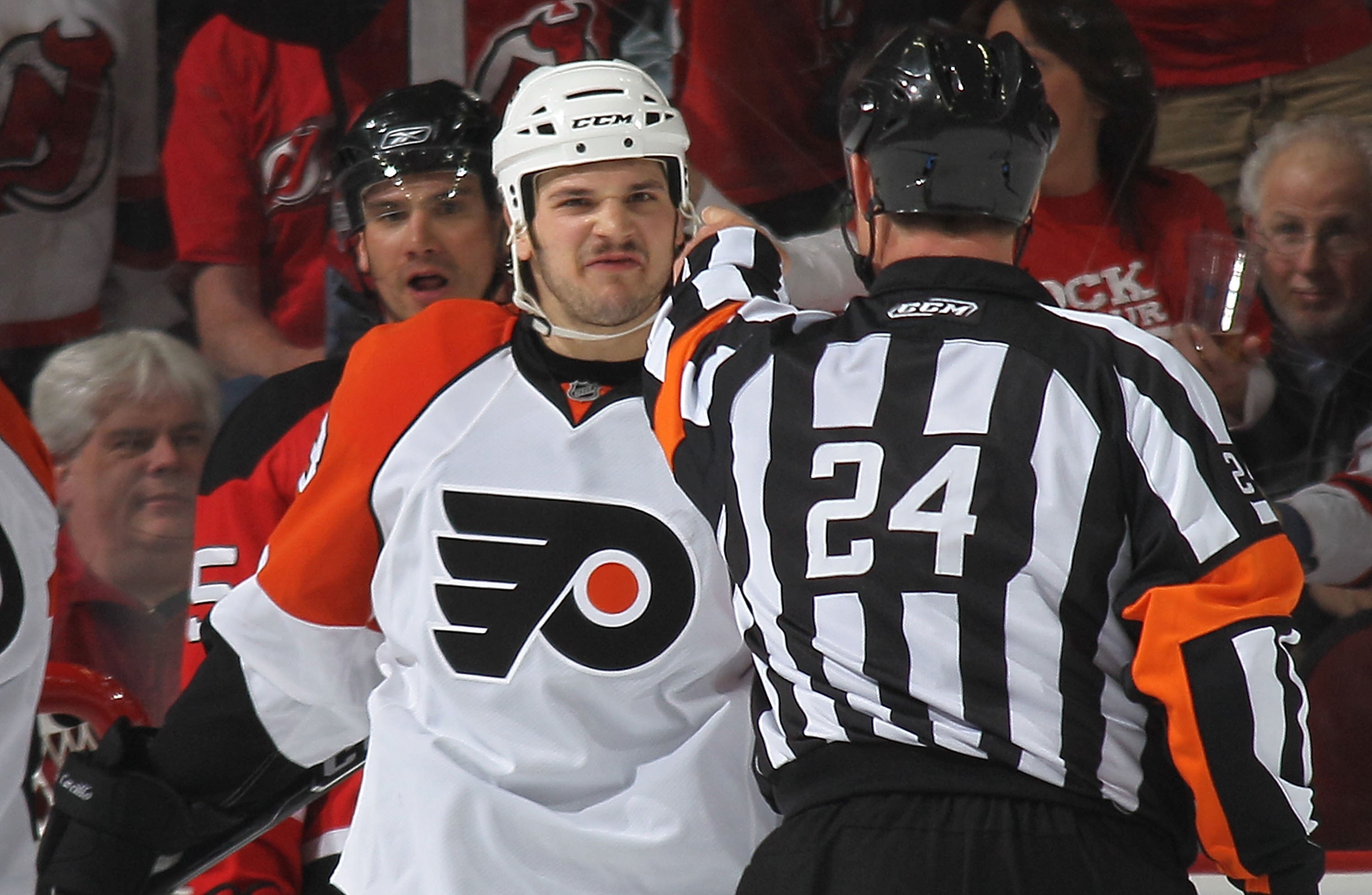 NEWARK, NJ - APRIL 14: Daniel Carcillo #13 of the Philadelphia Flyers argues a penalty call with referee Stephen Walkom #24 during the game against the New Jersey Devils in Game One of the Eastern Conference Quarterfinals during the 2010 NHL Stanley Cup P