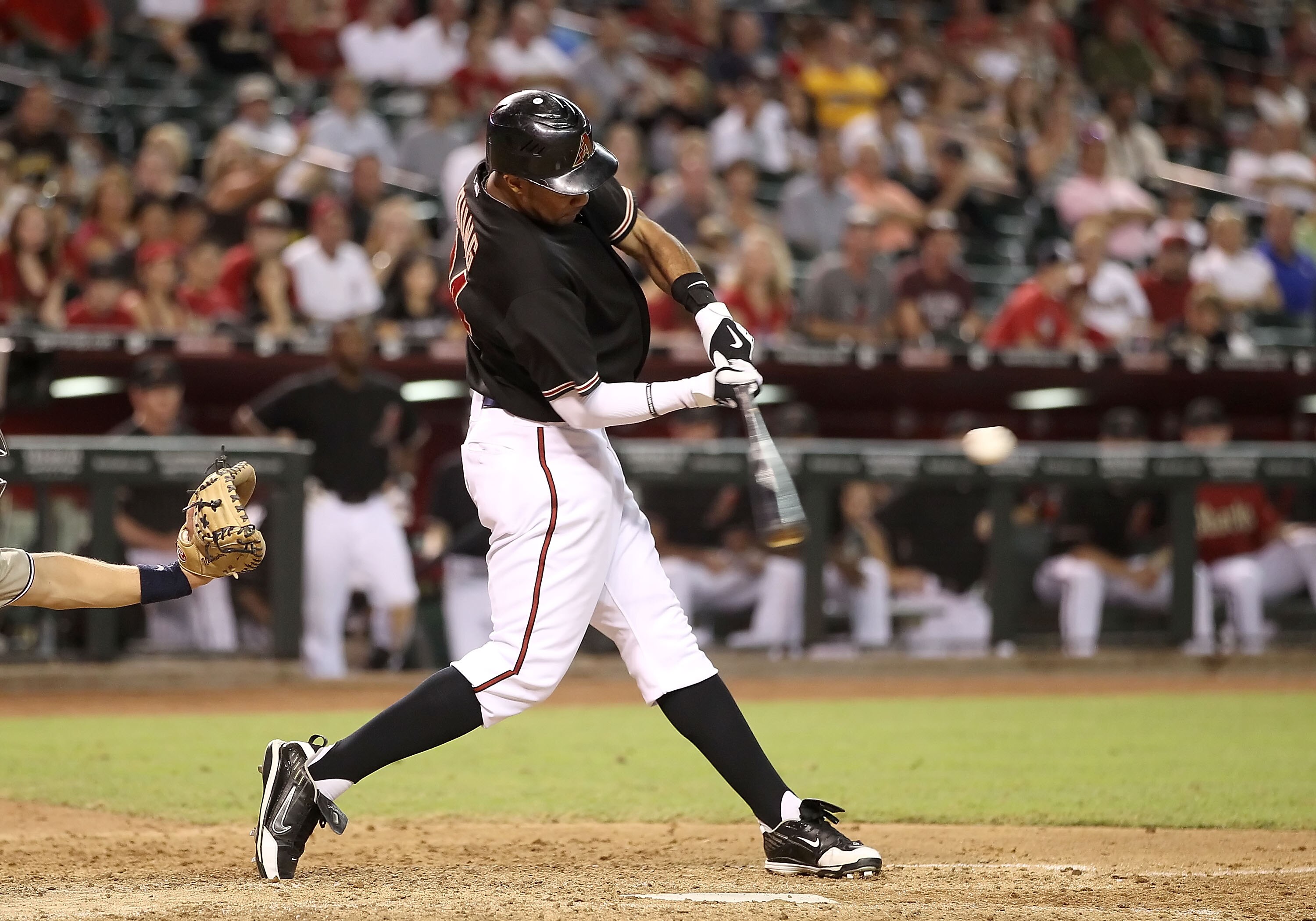 PHOENIX - AUGUST 07:  Chris Young #24 of the Arizona Diamondbacks hits a walk off solo home run against the San Diego Padres in the ninth inning of the Major League Baseball game at Chase Field on August 7, 2010 in Phoenix, Arizona. The Diamondbacks defea