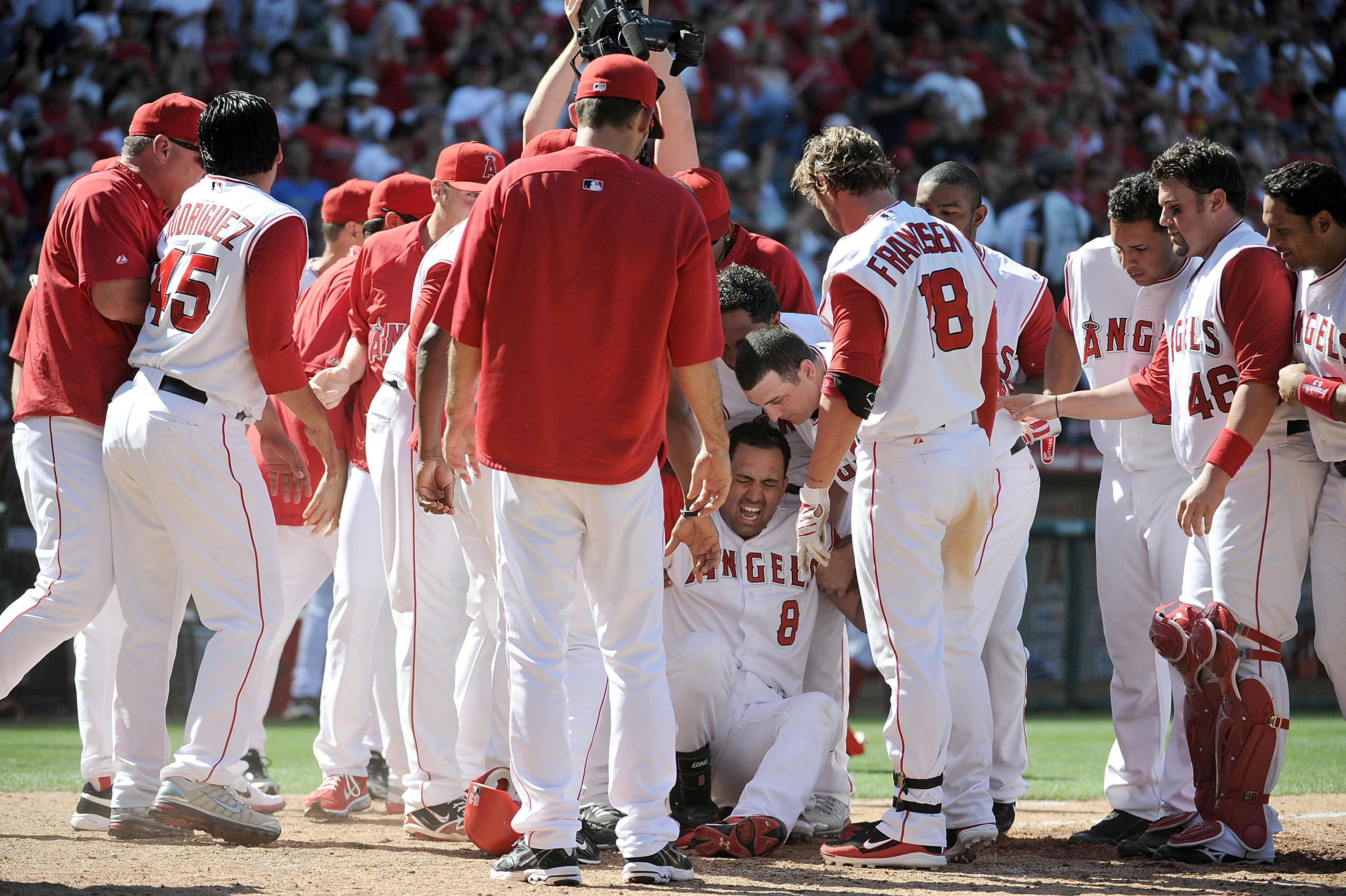 ANAHEIM, CA - MAY 29:  Kendry Morales #8 of the Los Angeles Angels reacts to his injury on his way to home plate after his grand slam homerun to win the game 5-1 over the Seattle Mariners during the bottom of the ninth inning at Angel Stadium on May 29, 2