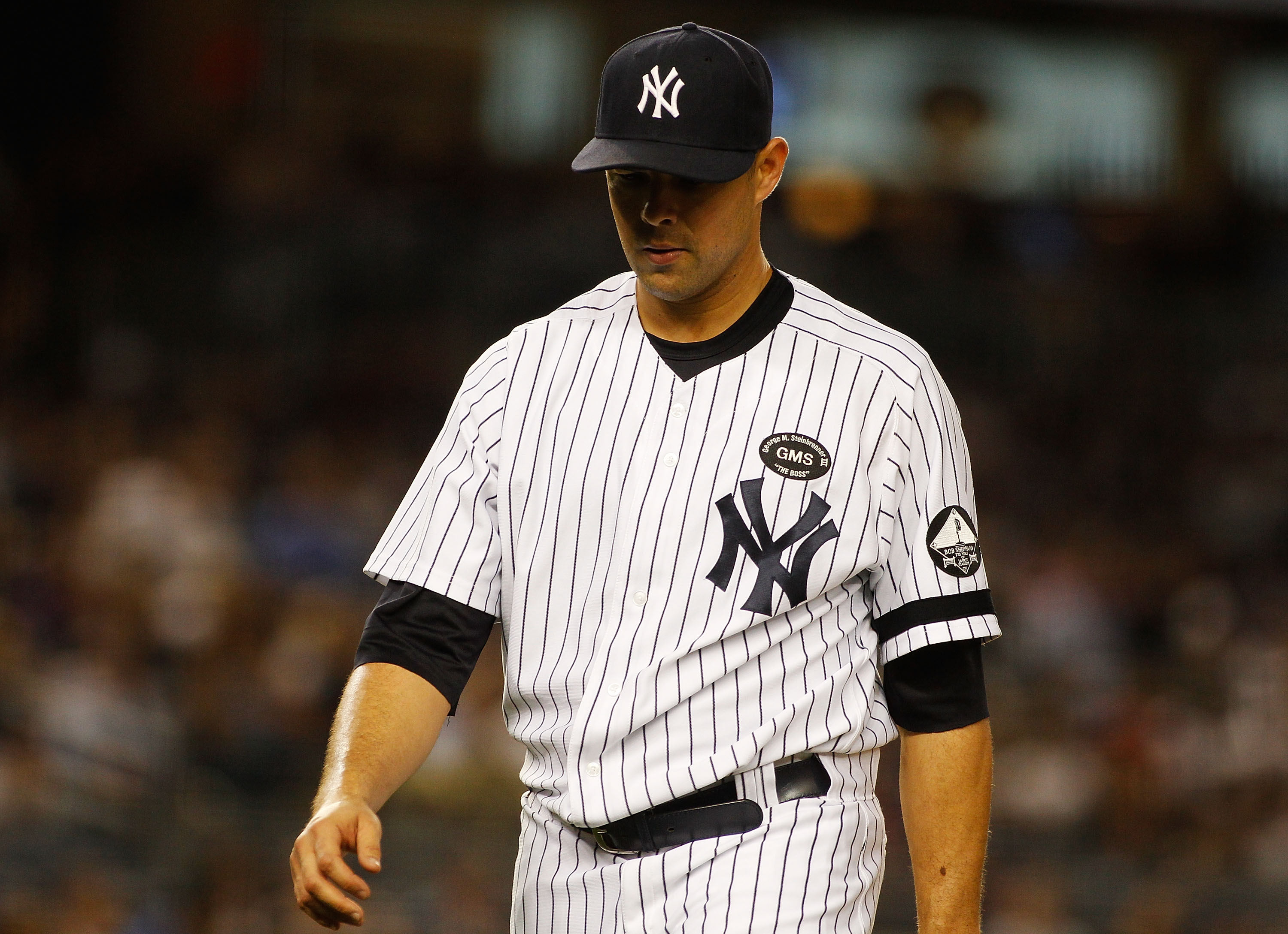 NEW YORK - SEPTEMBER 23:  Javier Vazquez #31 of the New York Yankees walks off the mound after giving up two runs in the seventh-inning against the Tampa Bay Rays on September 23, 2010 at Yankee Stadium in the Bronx borough of New York City.  (Photo by Mi