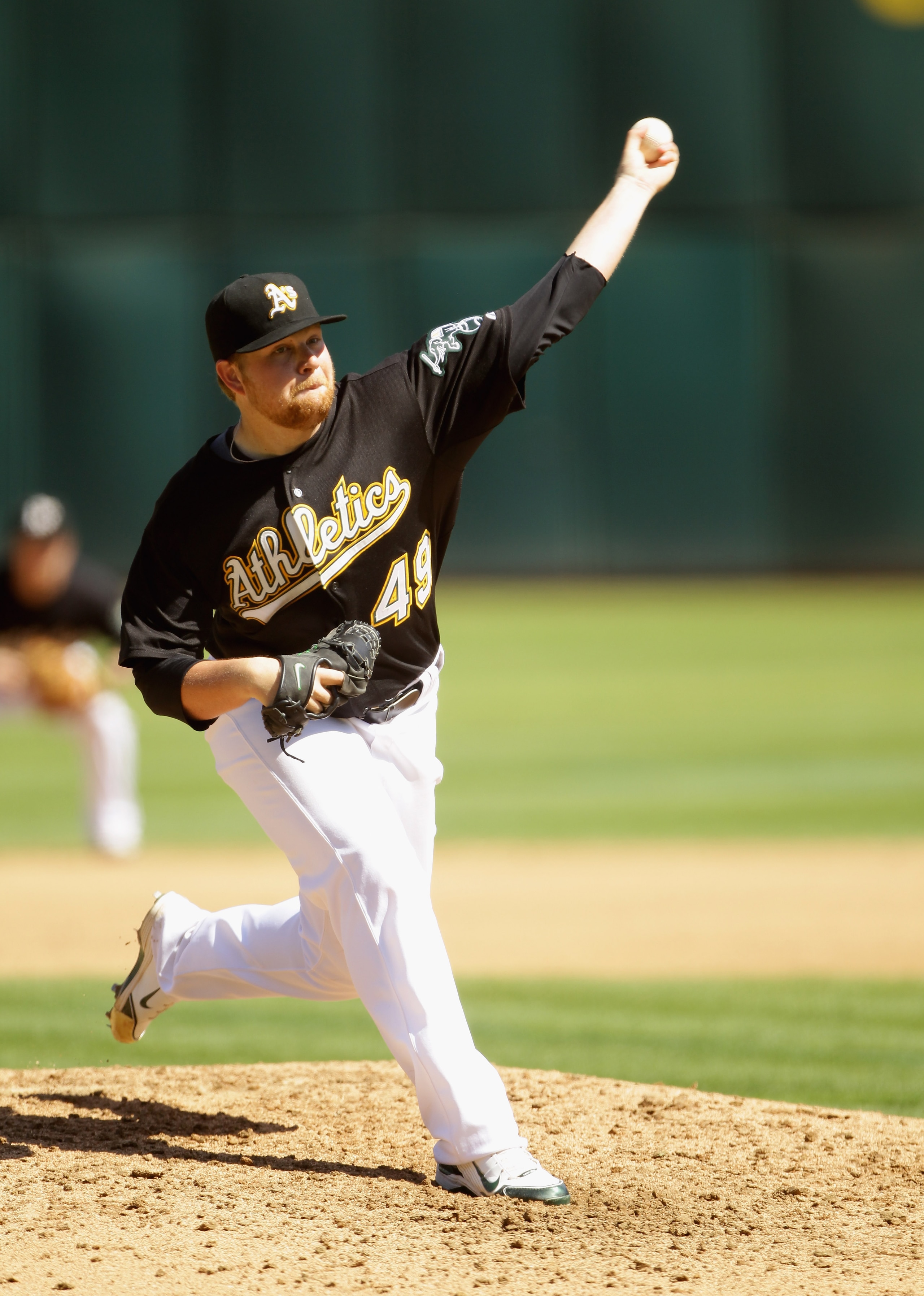 OAKLAND, CA - SEPTEMBER 22:  Brett Anderson #49 of the Oakland Athletics pitches against the Chicago White Sox at the Oakland-Alameda County Coliseum on September 22, 2010 in Oakland, California.  (Photo by Ezra Shaw/Getty Images)