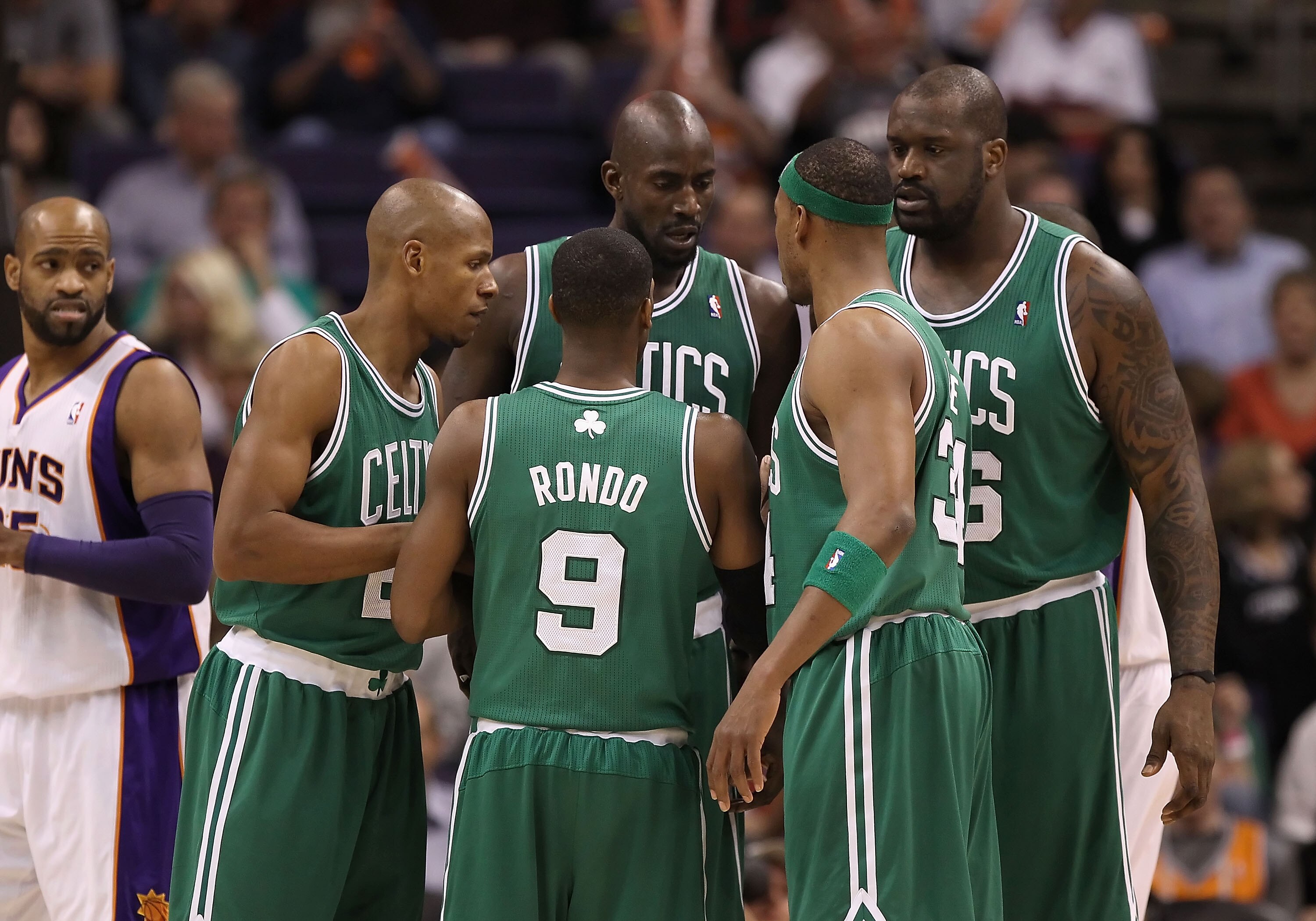PHOENIX, AZ - JANUARY 28:  (L-R) Ray Allen #20, Rajon Rondo #9, Kevin Garnett #5, Paul Pierce #34 and Shaquille O'Neal #36 of the Boston Celtics huddle up during the NBA game against the Phoenix Suns at US Airways Center on January 28, 2011 in Phoenix, Ar