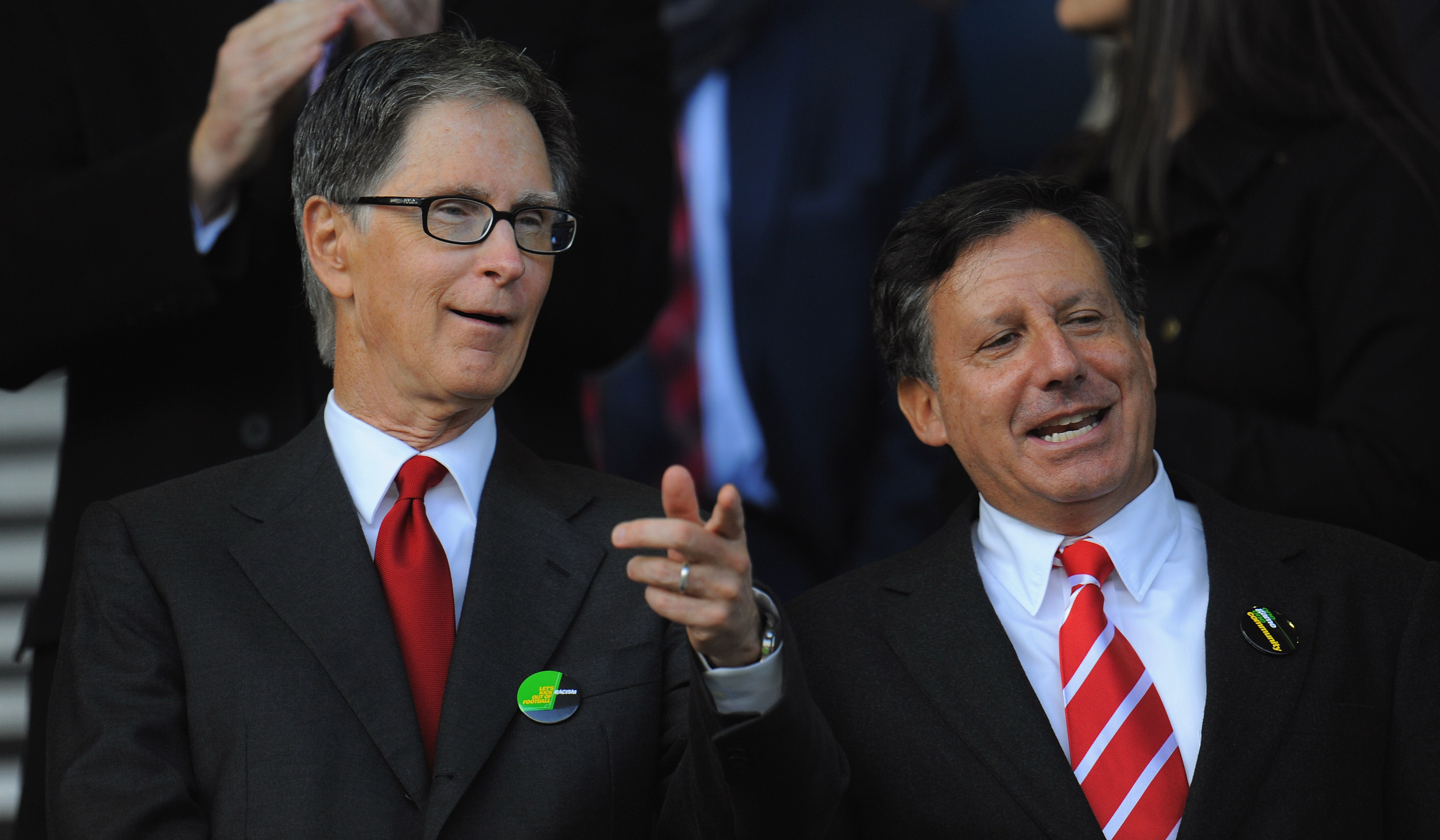LIVERPOOL, ENGLAND - OCTOBER 17: New Liverpool co-owners John W Henry (L) and NESV Chairman Tom Werner look on during the Barclays Premier League match between Everton and Liverpool at Goodison Park on October 17, 2010 in Liverpool, England.  (Photo by Mi